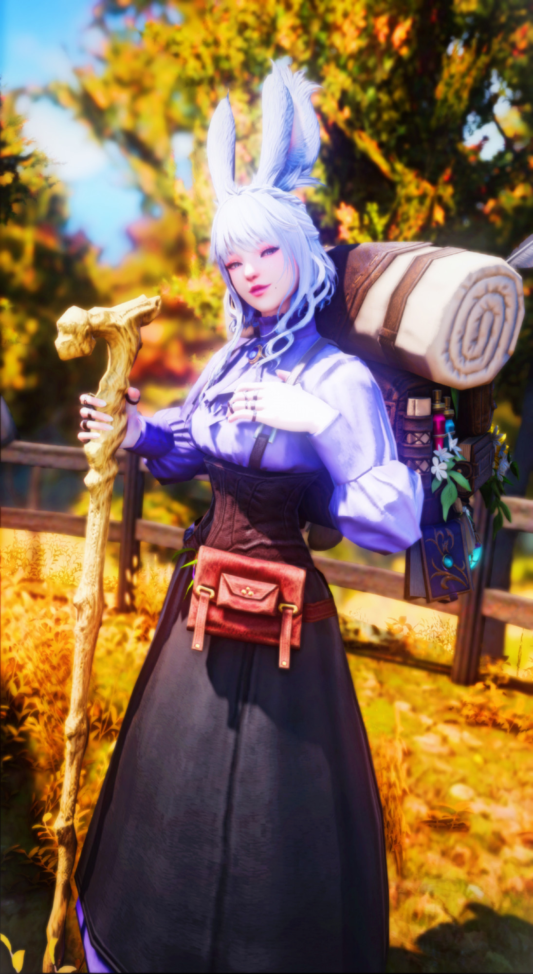 Elysea, my OC from FFXIV. She is a veena viera with silver-blue hair, blue-gray eyes, and pale skin. She is wearing a brown leather corset over a lavender colored blouse and a black leather skirt. She tolds a staff in one hand as a walking stick for support, and her other hand has a thumb which is hooked under the suspenders. She also has a bag at her hip, and a backpack on her back, both which are stuffed with herbs, potions, and other accoutrements common of a doctor and healer in Eorzea.