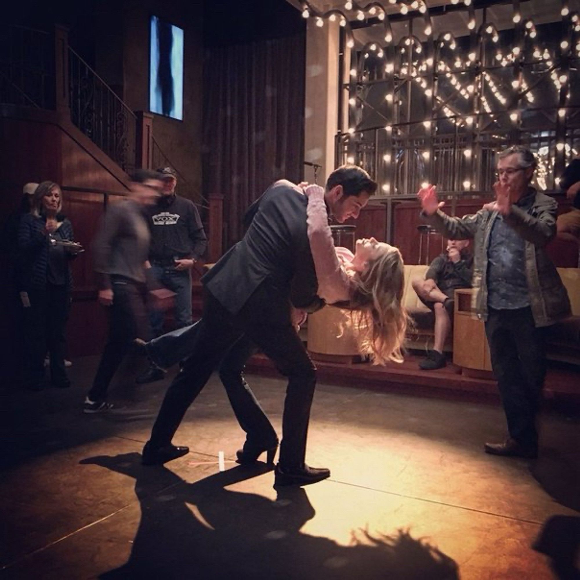 A behind the scenes pic of Tom Ellis & Lauren German dancing for Lucifer (Netflix).