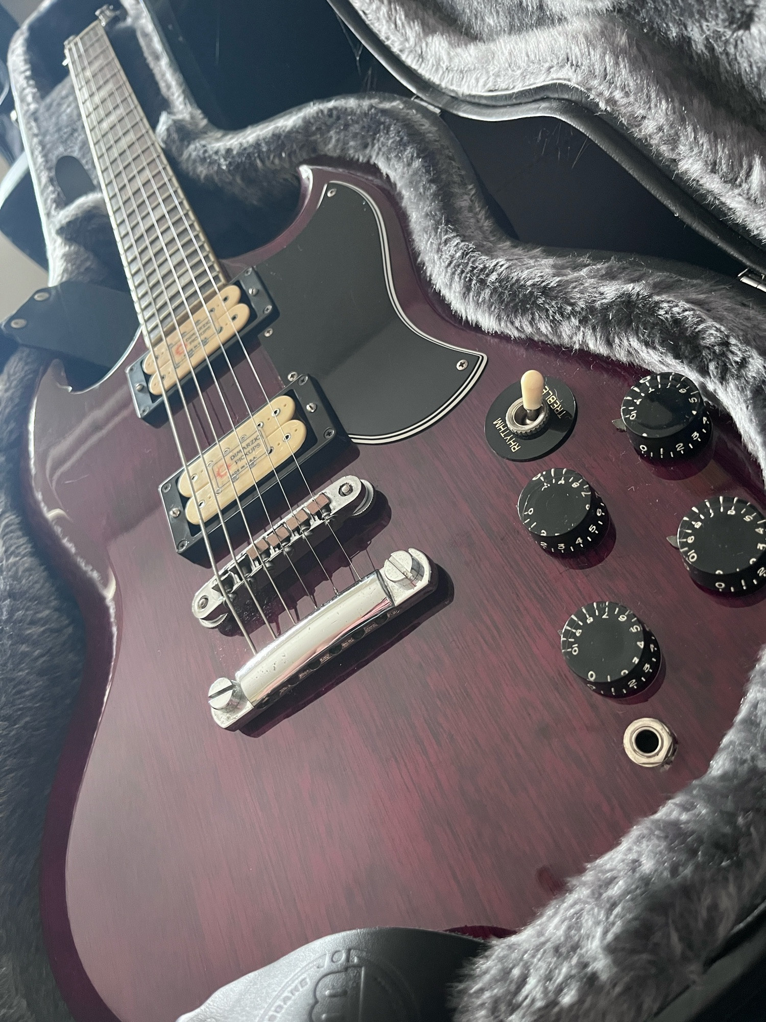 A mid-1970s Japanese copy of a Gibson SG in red finish with cream-coloured Dimarzio pickups.