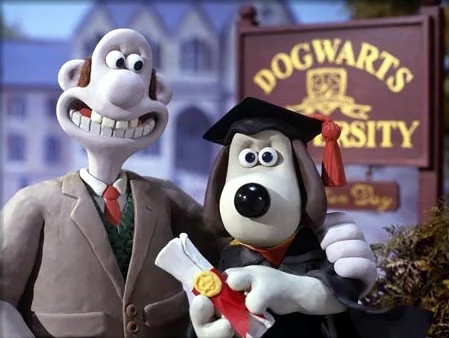 screenshot from wallace and gromit showing gromit is cap and gown standing outside dogwarts university