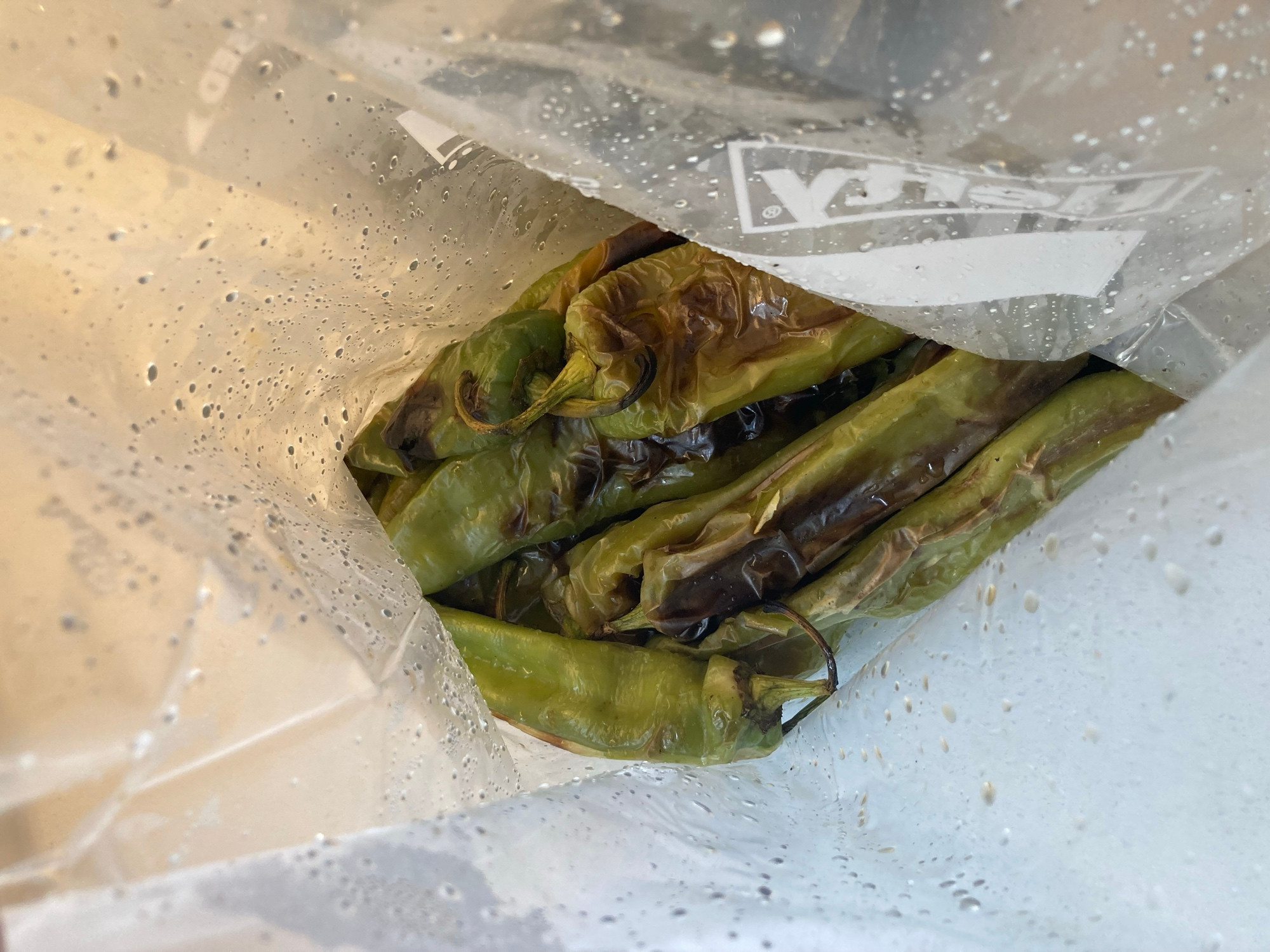 Inside one of the steamy ziplocks showing some charred green chiles