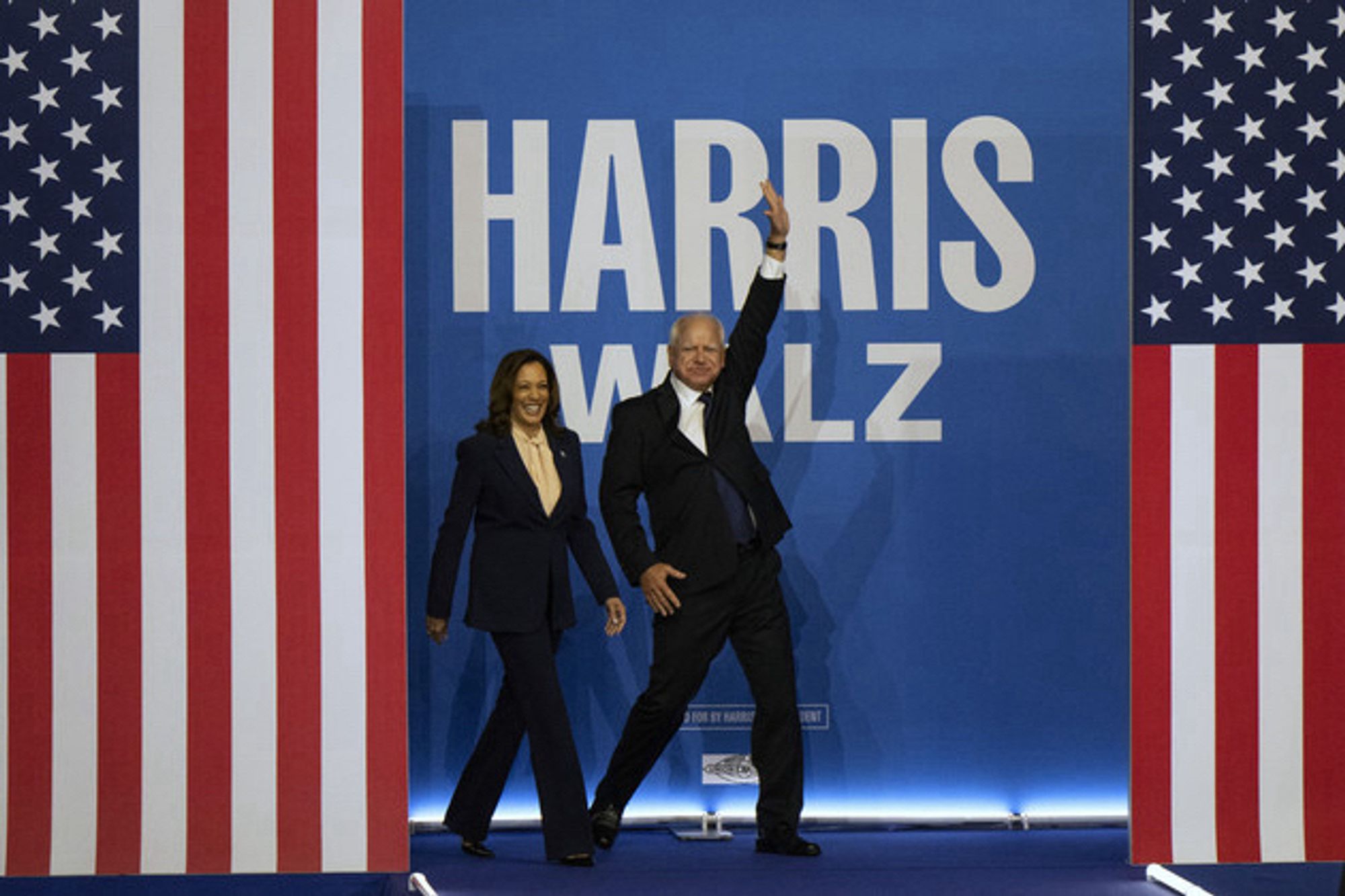 Harris and Walz hit the stage at a fundraiser of some kind. Walz strikes a Saturday Night Fever pose. I swear to god he does.