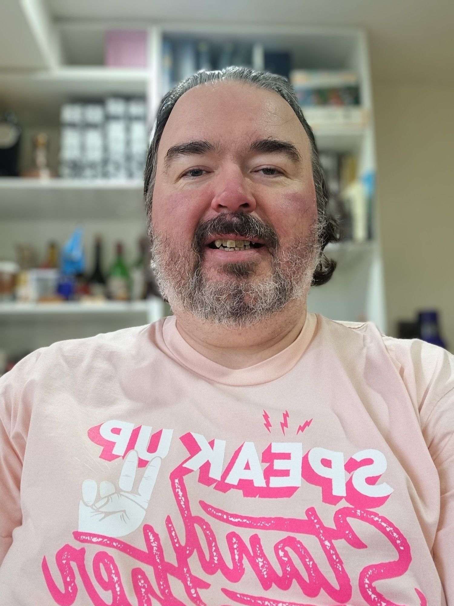 Selfie wearing a pink t-shirt with the Pink Shirt Day slogan: Speak Up, Stand Together, Stop Bullying