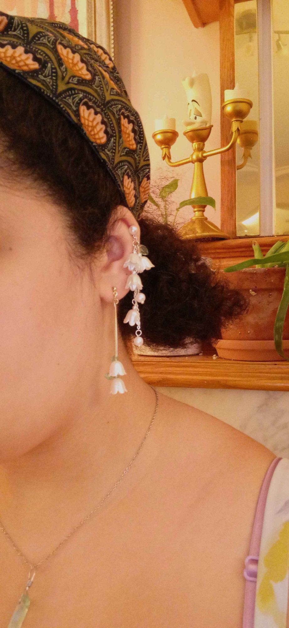 two sets of dangling white flower earrings