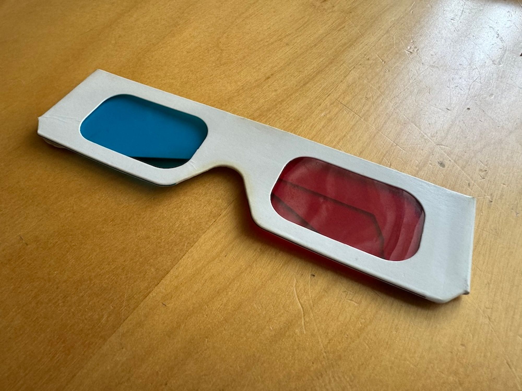 A pair of cardboard red/blue anaglyph glasses for watching 3D films