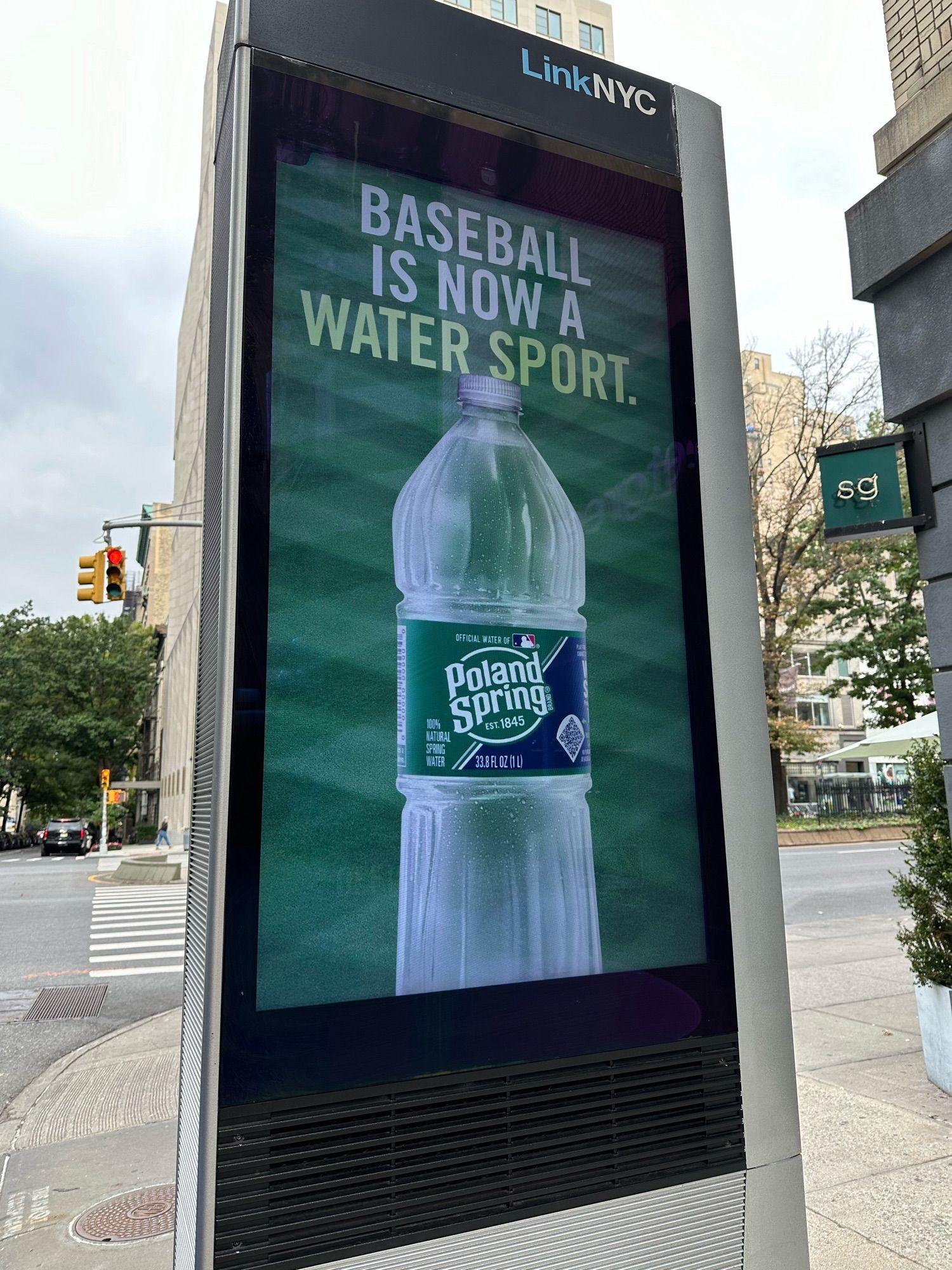 Poland Spring ad showing a bottle, a baseball field and the copy “baseball is now a water sport”