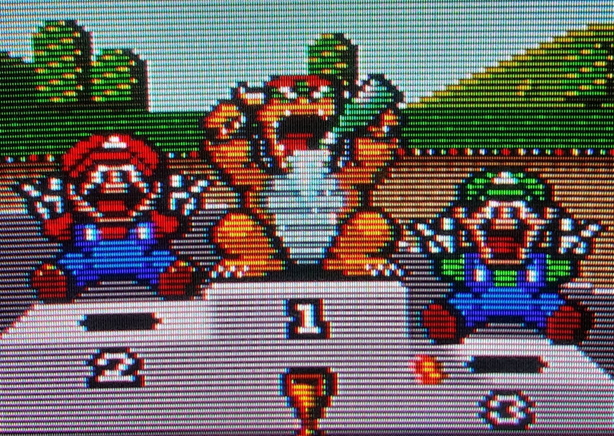 Japanese Bowser on the podium hitting the bottle hard. (North American Bowser was NOT allowed to) flanked by Mario and Luigi both flashing victory signs.