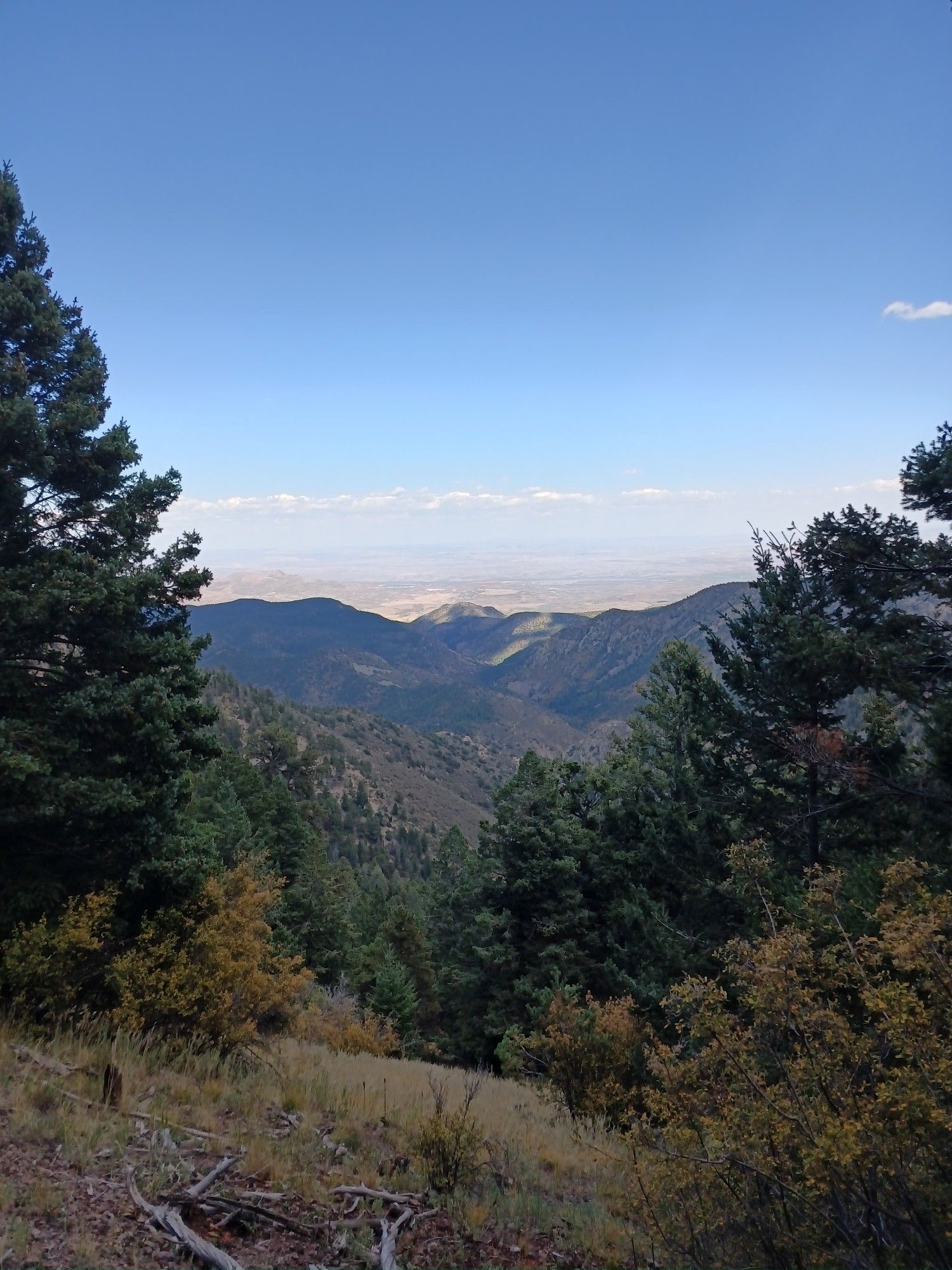 view from the mountain looking down and east towards the rio grande valley and beyond way far away