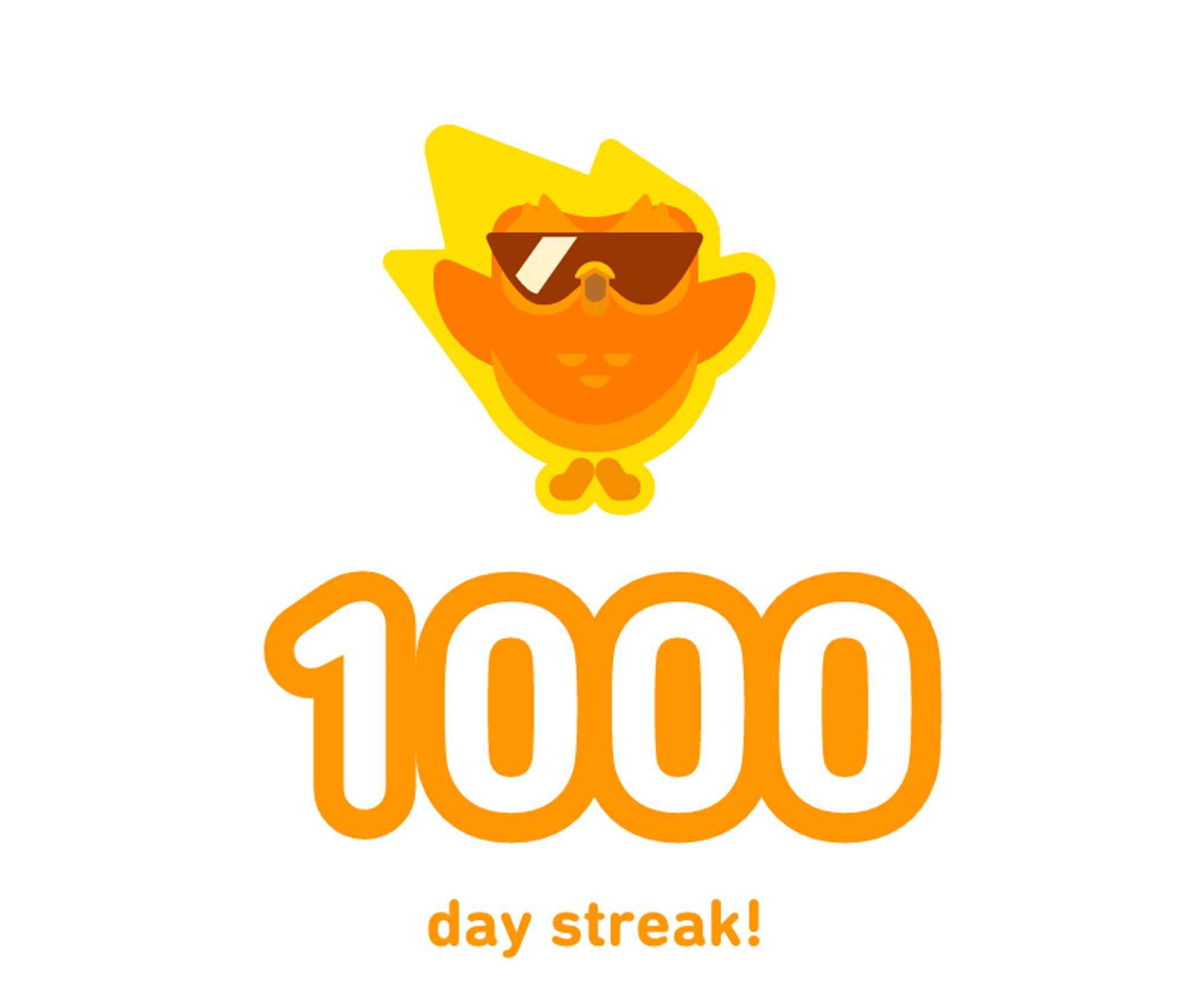 a notification of a 1000-day Duolingo streak, complete with orange cartoon owl wearing sunglasses, in a sort of comet-like yellow blaze