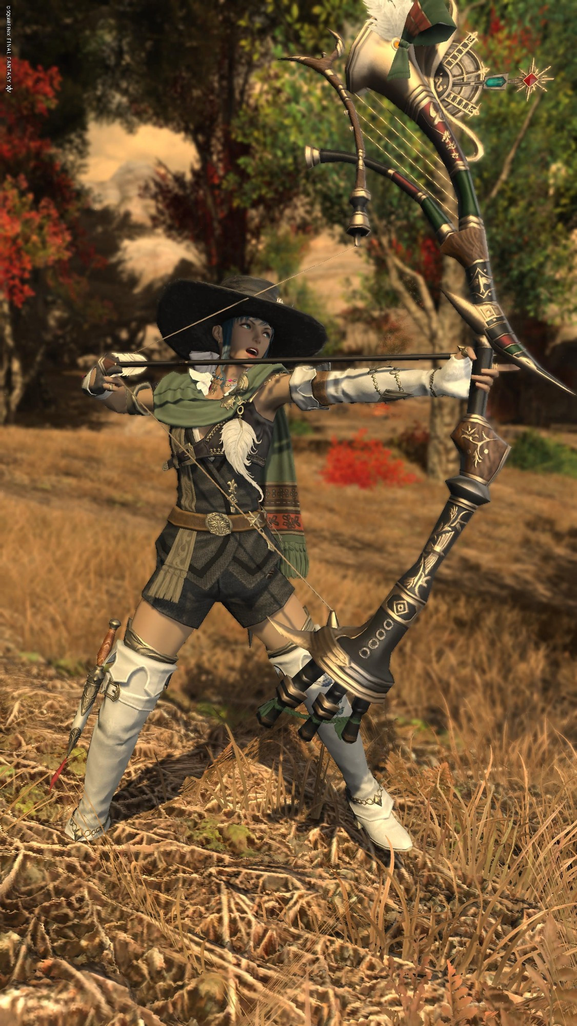 Agatha Taundfeld draws her longbow in a forest full of fall foliage. 