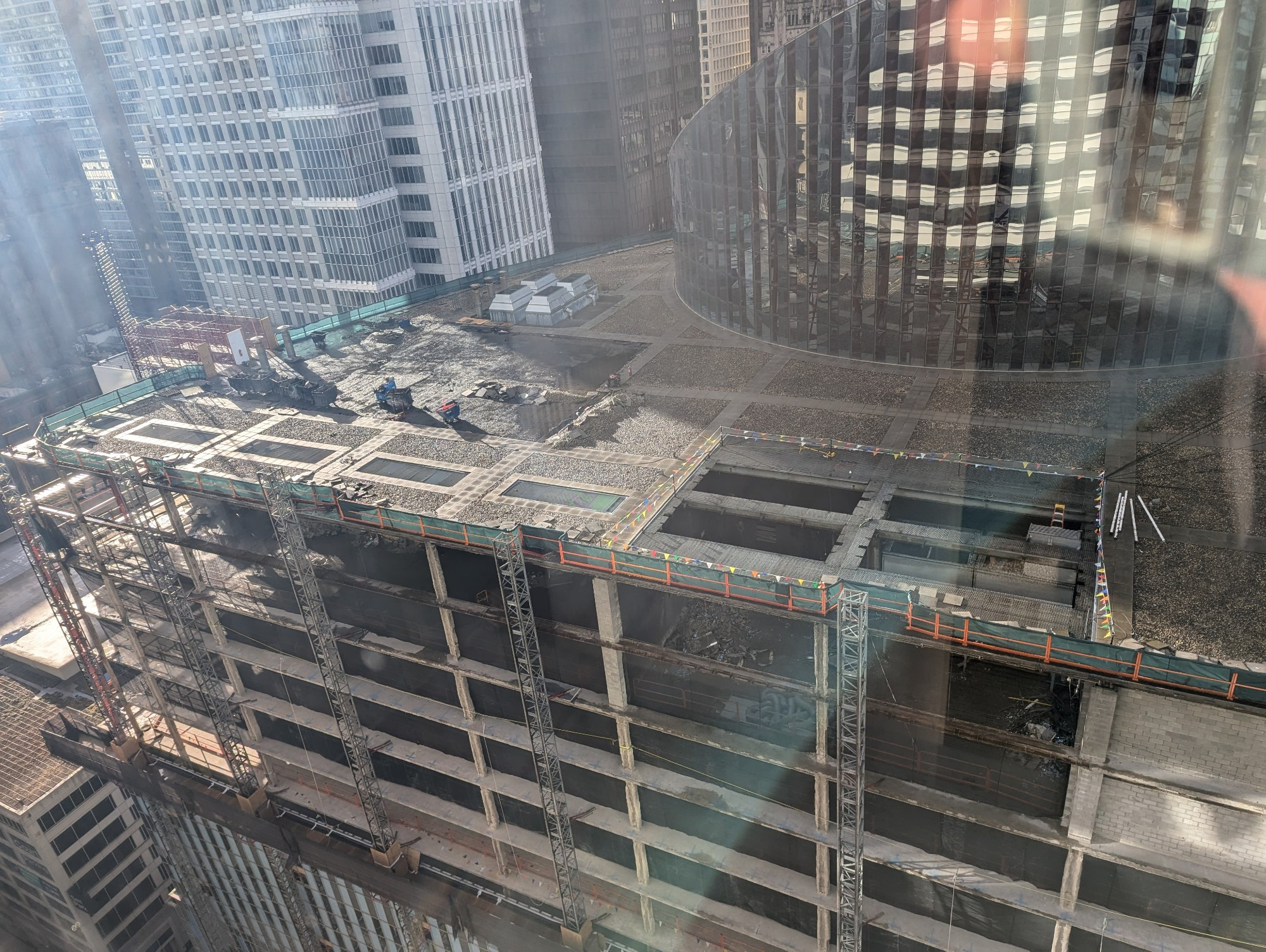 The Thompson Center building in Chicago, parts of the roof and the window wall along the north side have been removed. 