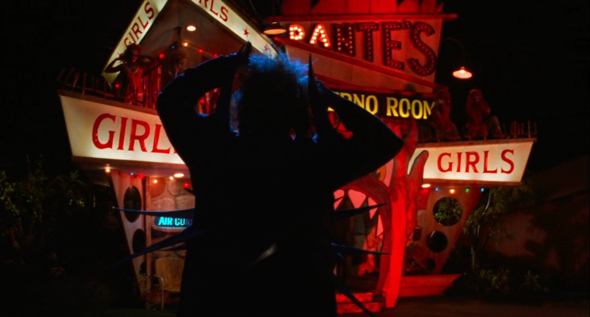 blue-hued silhouette of Beetlejuice in front of a red neon whorehouse