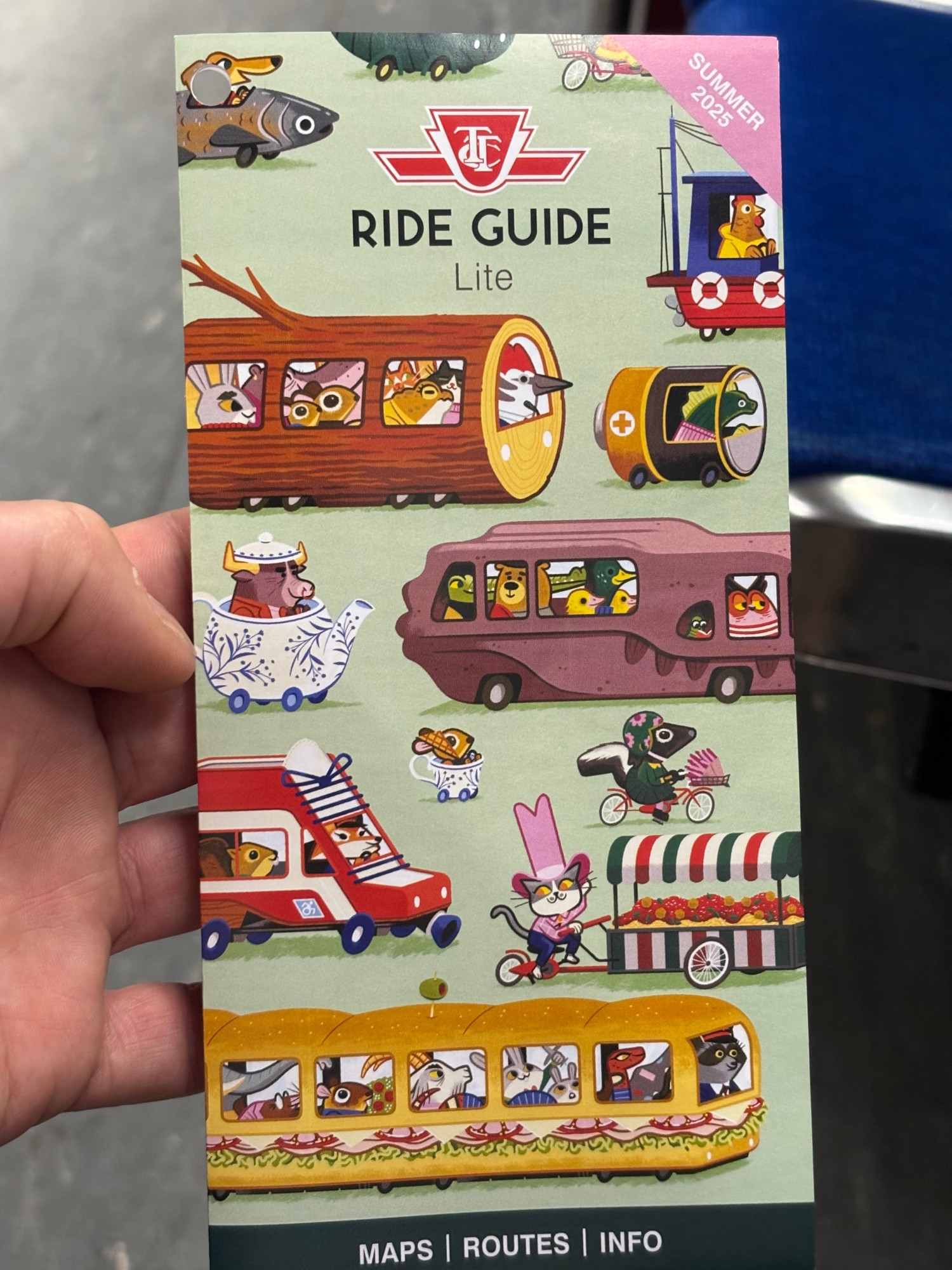 Toronto Transit Commission Ride Guide 2025 cover, in a Richard Scarry style w Totonto flourishes.