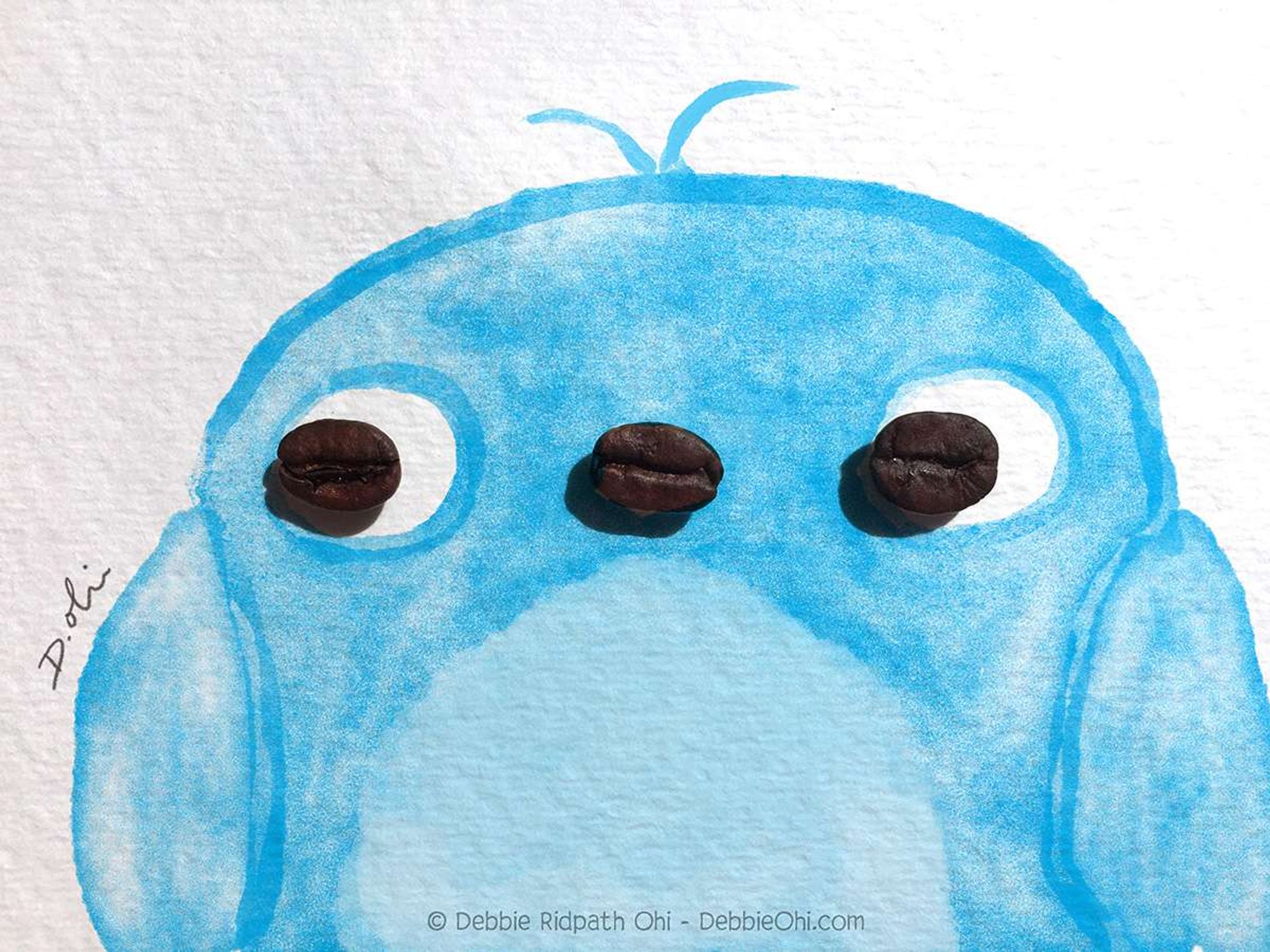 Found object art featuring three coffee beans in an illustration of a bluebird. Two of the beans are the bird's eyes, and the middle bean is the bird's beak. Artist: Debbie Ridpath Ohi