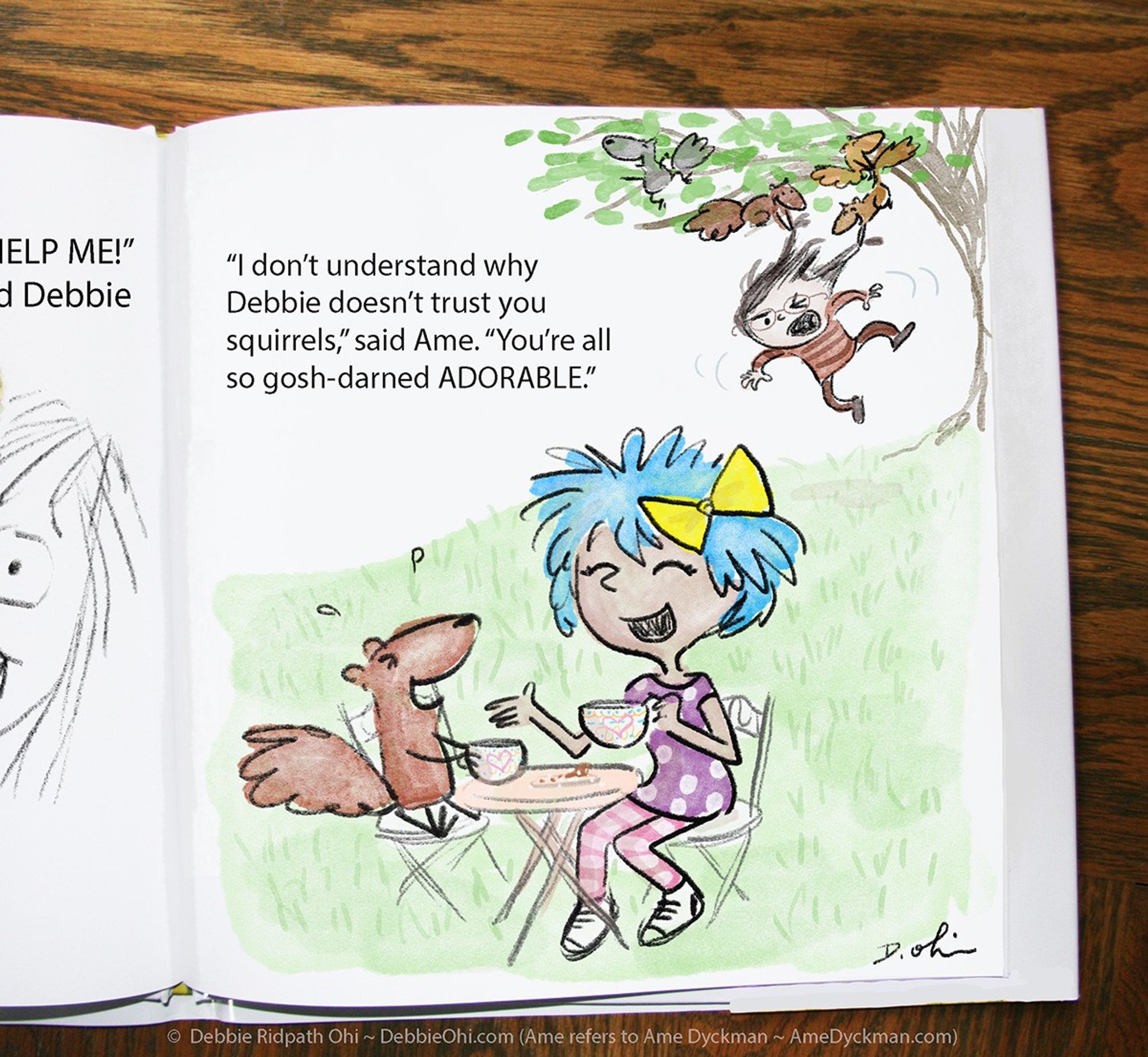 Photo shows page from an open book. Illustration shows blue-haired girl happily having tea with a squirrel. In the background, we see squirrels playing with the hair of an irritated-looking girl in glasses. Text reads: "'I don't understand why Debbie doesn't trust you squirrels,' said Ame. 'You're all so gosh-darned ADORABLE.'"