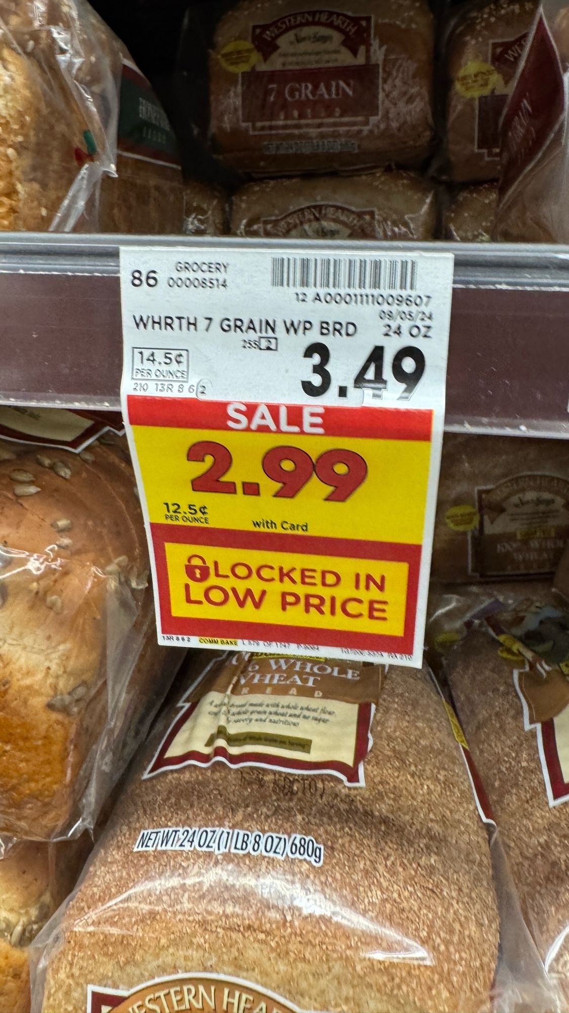 A grocery store indicating the price of bread at $3.49 but on sale at the new, locked in low price of $2.99, which is what that same loaf used to cost until a few months ago.