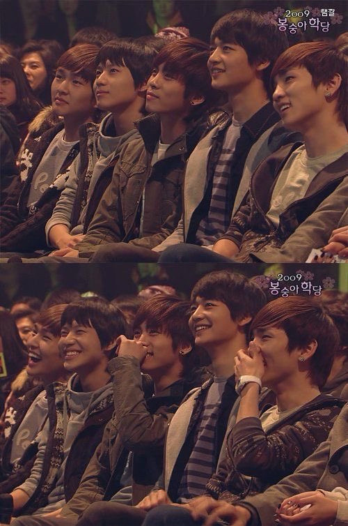 Small SHINee 5 sitting in a row smiling looking up and laughing 2009