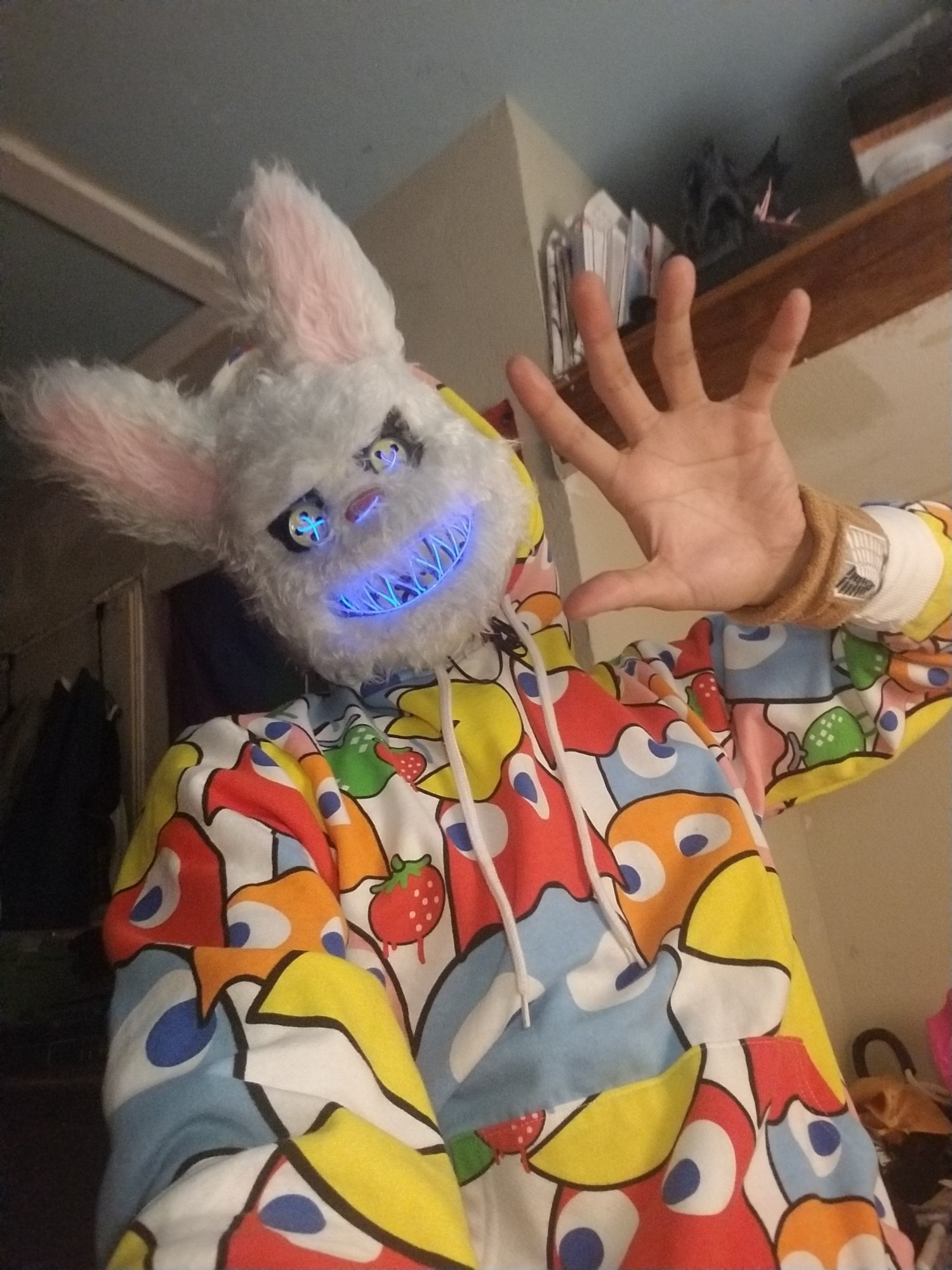 UltraEvilZero in a scary Easter bunny mask with a pacman hoodie waving