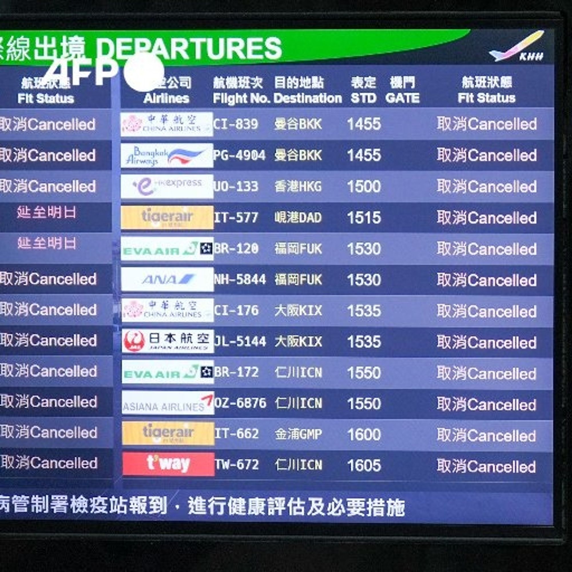 A digital departure board displaying flight information at an airport amid Typhoon Krathon's impact on Taiwan. The board's header reads "DEPARTURES" in English and features a green background. Below this, there are multiple rows listing canceled flights. Each row includes details such as the airline name (e.g., EVA AIR, Asiana Airlines), flight numbers (e.g., BR-839, NH-584), destinations (e.g., Bangkok, Singapore), scheduled departure times, and gate numbers. The status for all listed flights is marked as "Cancelled." The overall atmosphere of the board suggests disruption and travel difficulties due to severe weather conditions.