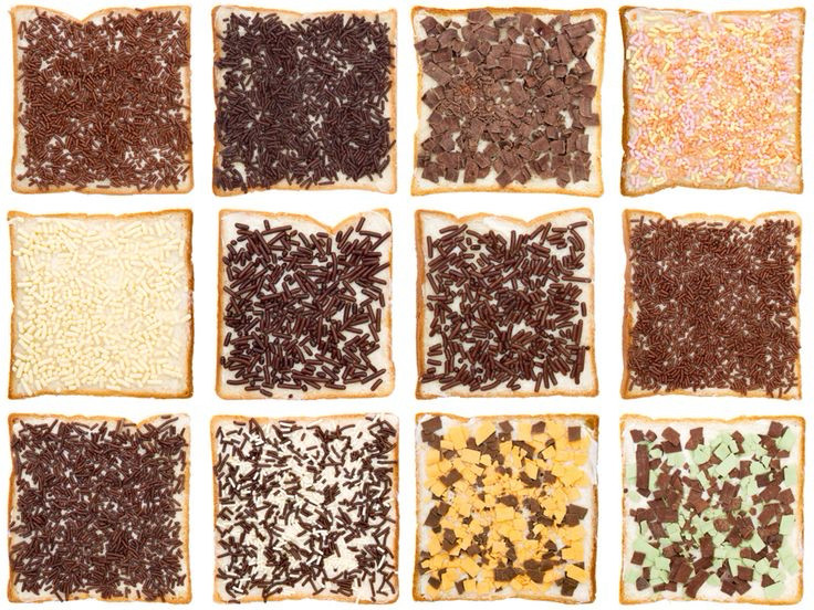 12 slices of bread (arranged 3 by 4) all with different kinds of chocolate sprinkles. From dark chocolate to white chocolate to mixed