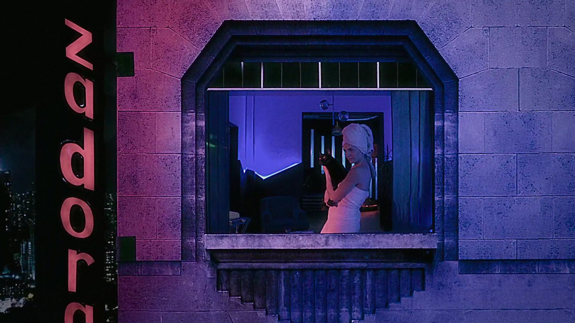 Crystal Eyes (2017) a woman cuddles a black cat in the window of an '80s art deco revival apartment under bisexual lighting