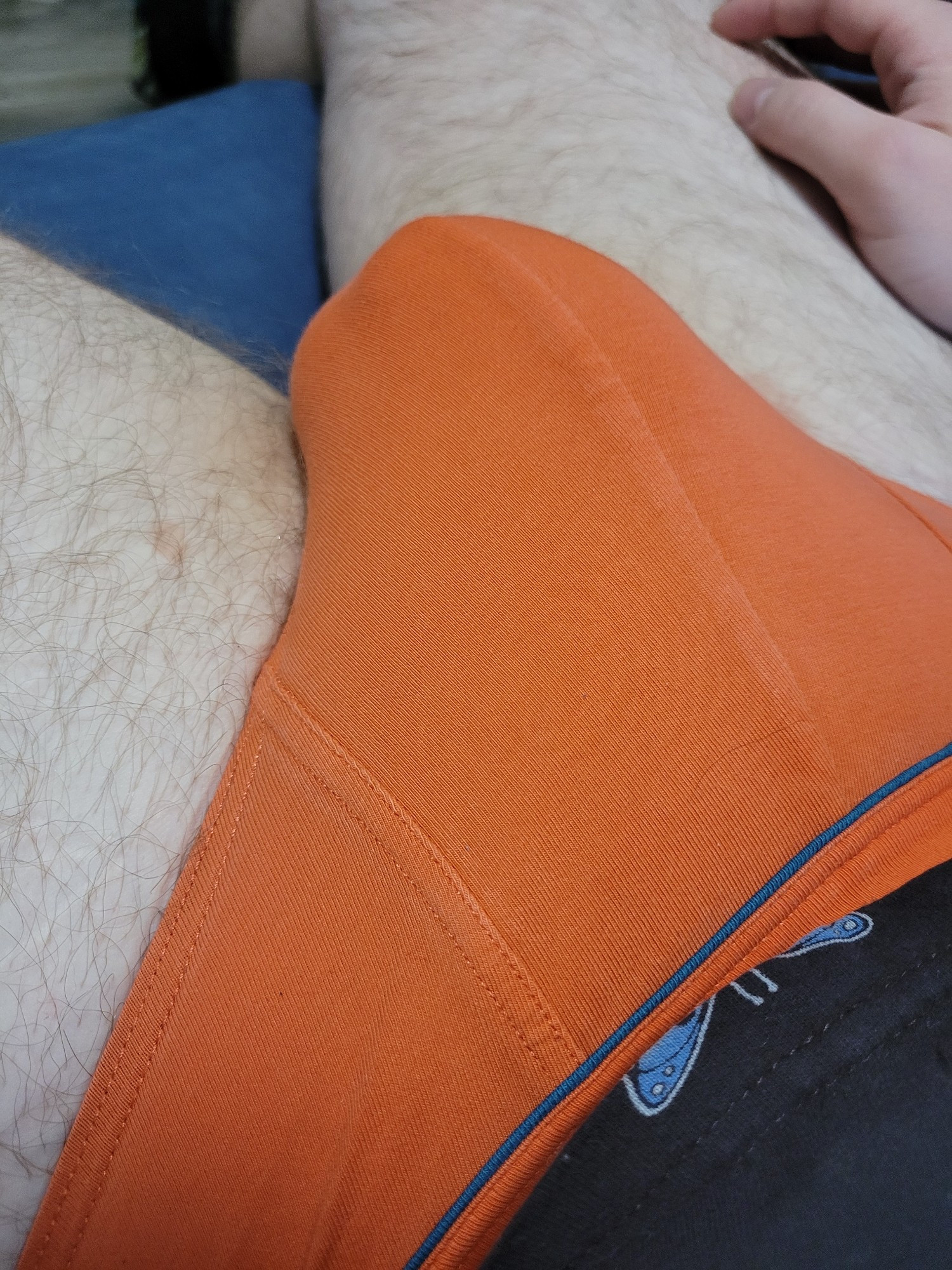 A bulge in a pair of orange briefs.