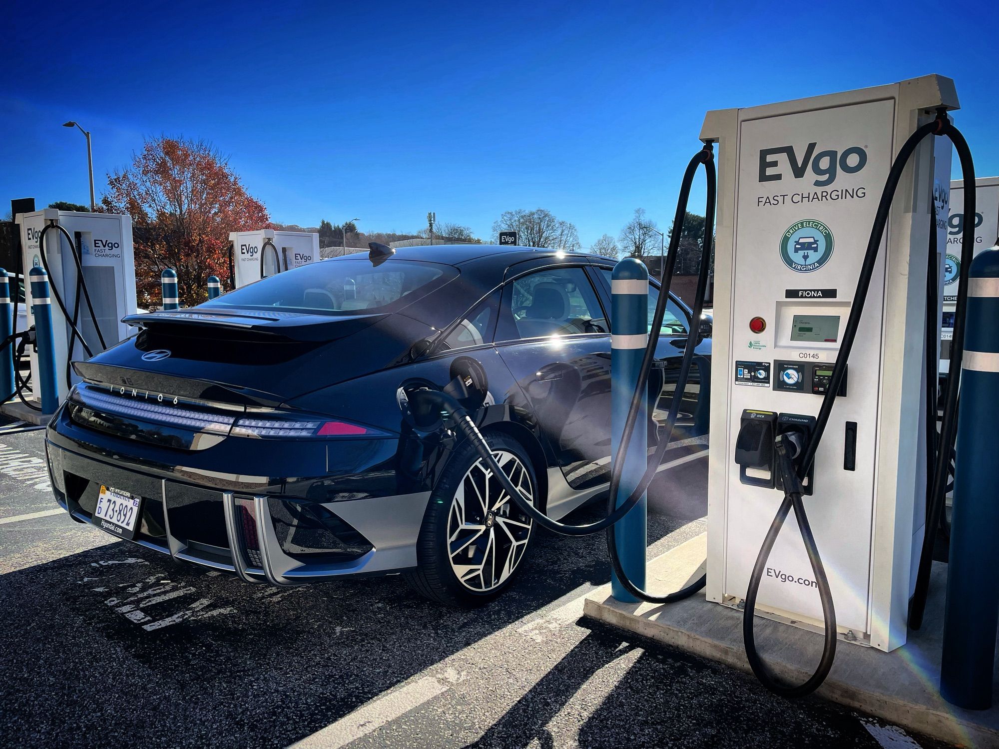 Right rear three-quarter view of the 2023 Hyundai IONIQ 6 Limited charging at an EVgo station