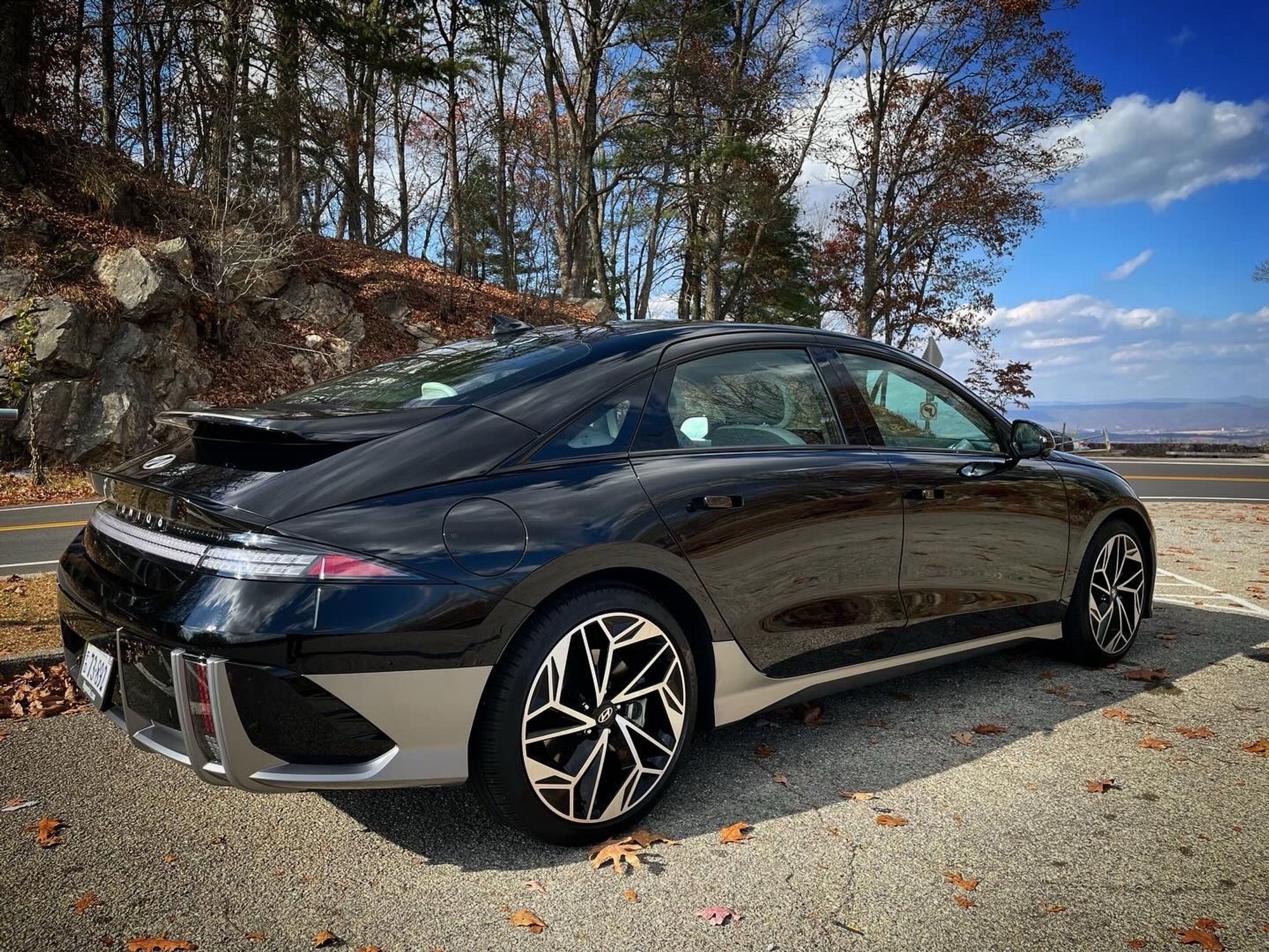 Right rear three-quarter view of the 2023 Hyundai IONIQ 6 parked at Draper Valley Mountain Overlook in Pulaski, Virginia