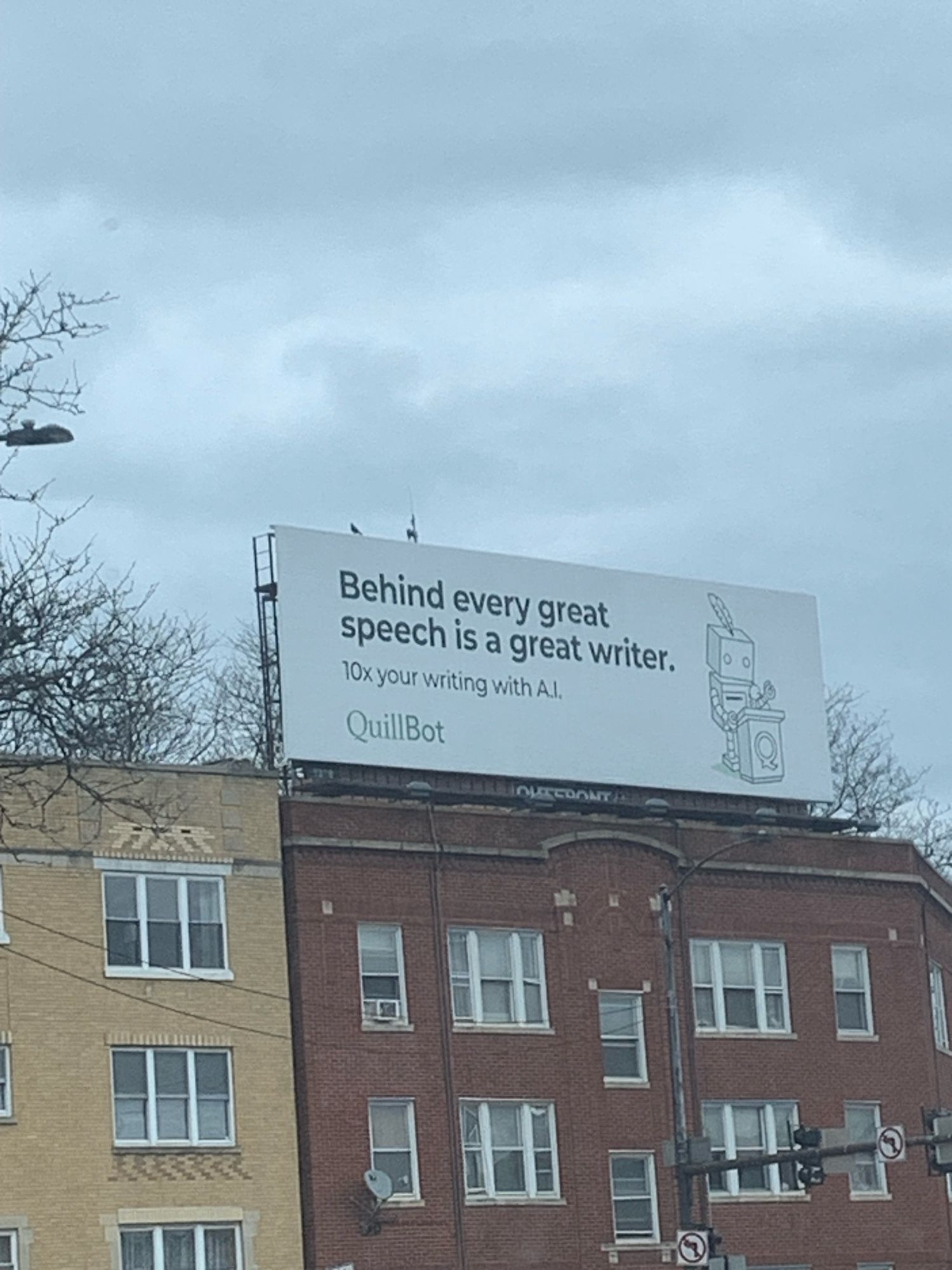 a billboard for Quillbot with a robot that says “behind every great speech is a great writer, 10x your writing with A.I.”