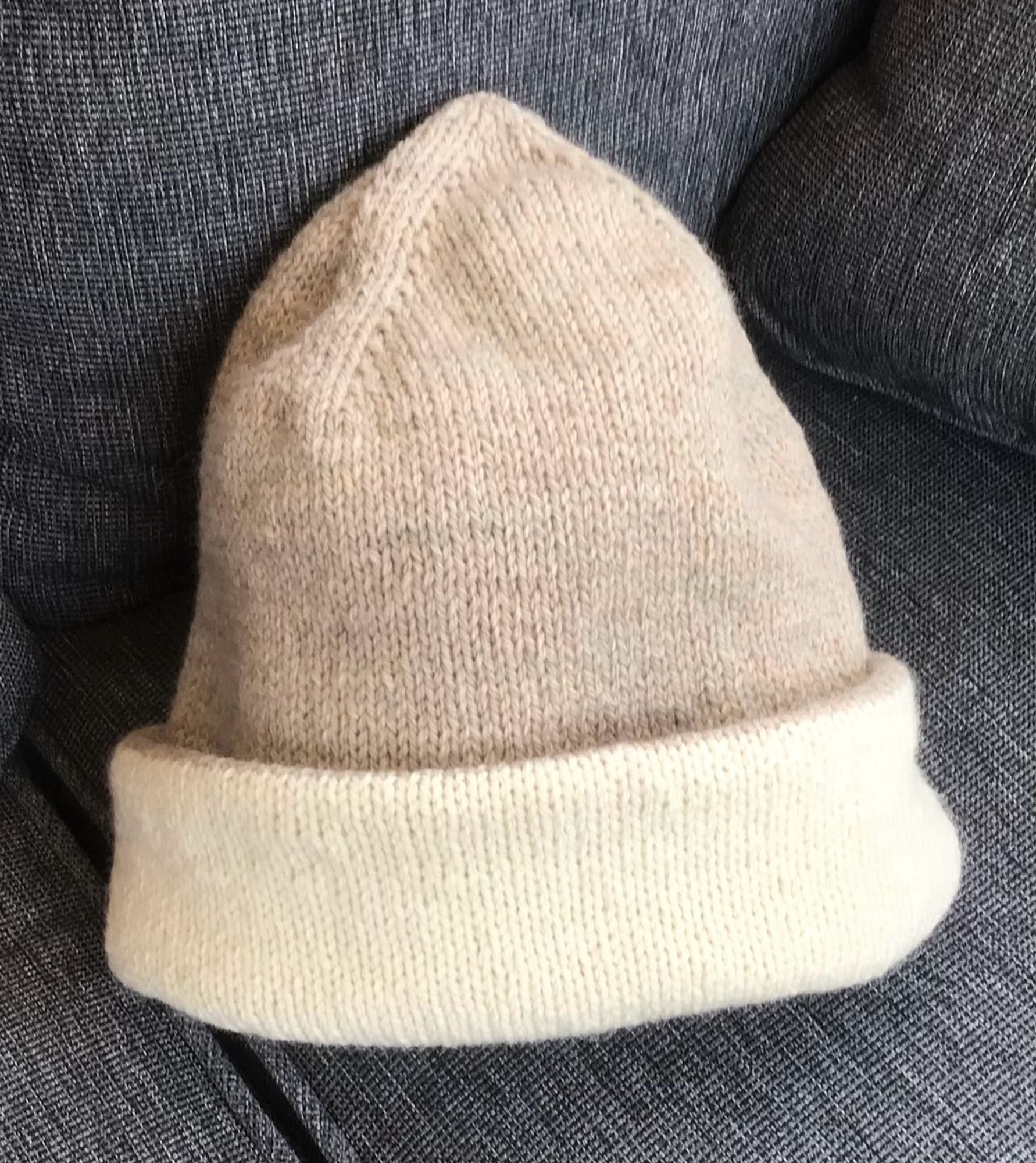 Knit hat, double sided, wool. Shown with beige top and cream folded brim