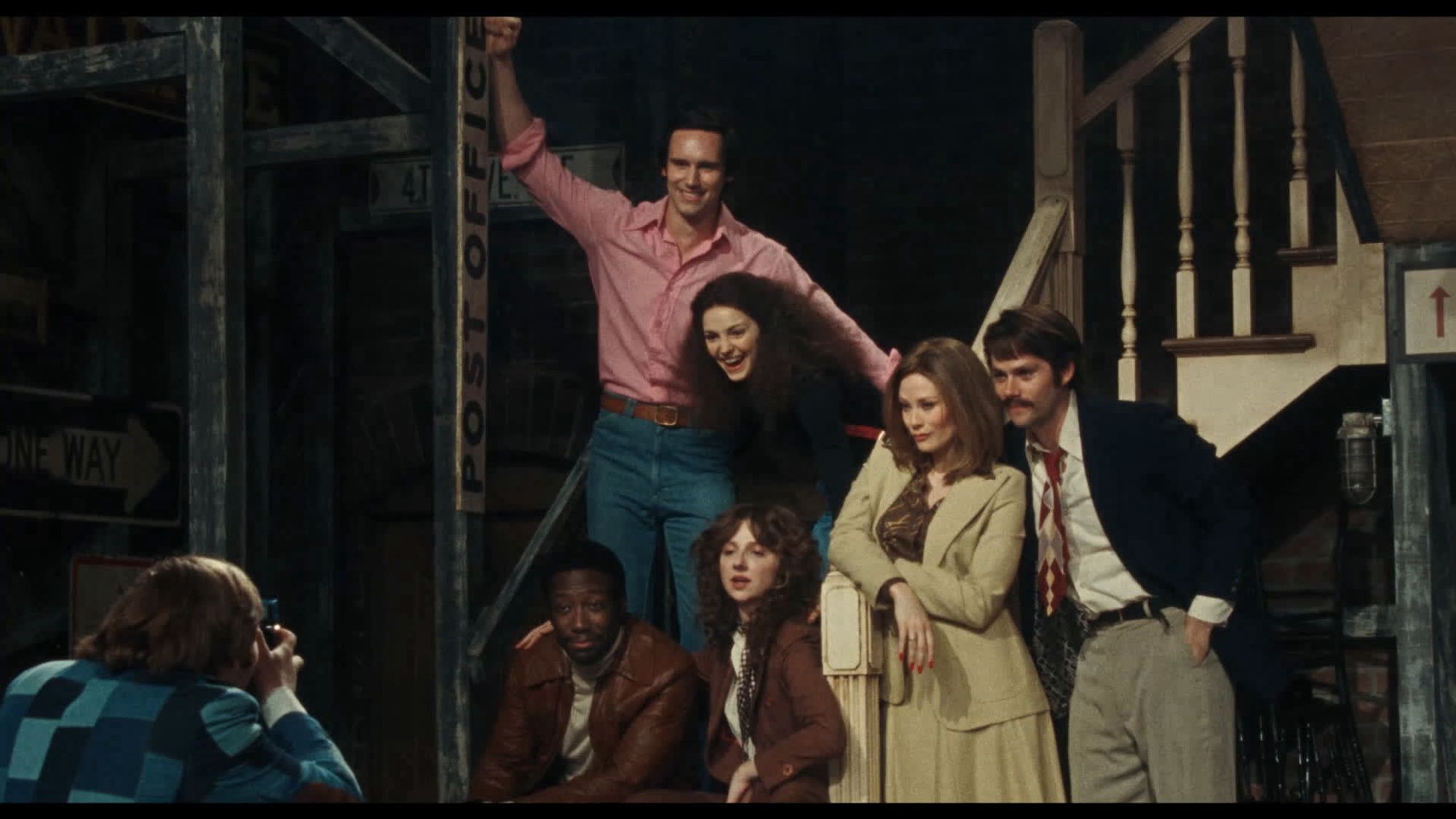 The original cast of Saturday night live had their picture taken on some stairs on the set a minute before broadcast on their first episode.