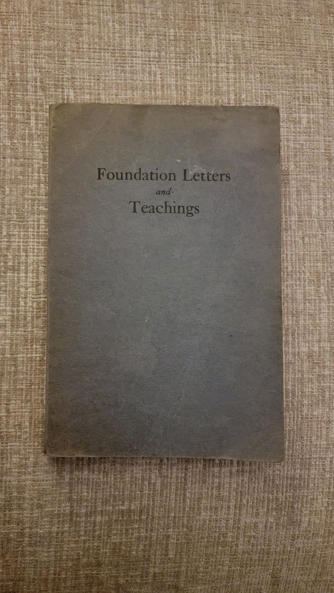 Faded blue paper cover of a book titled Foundation Letters and Teachings