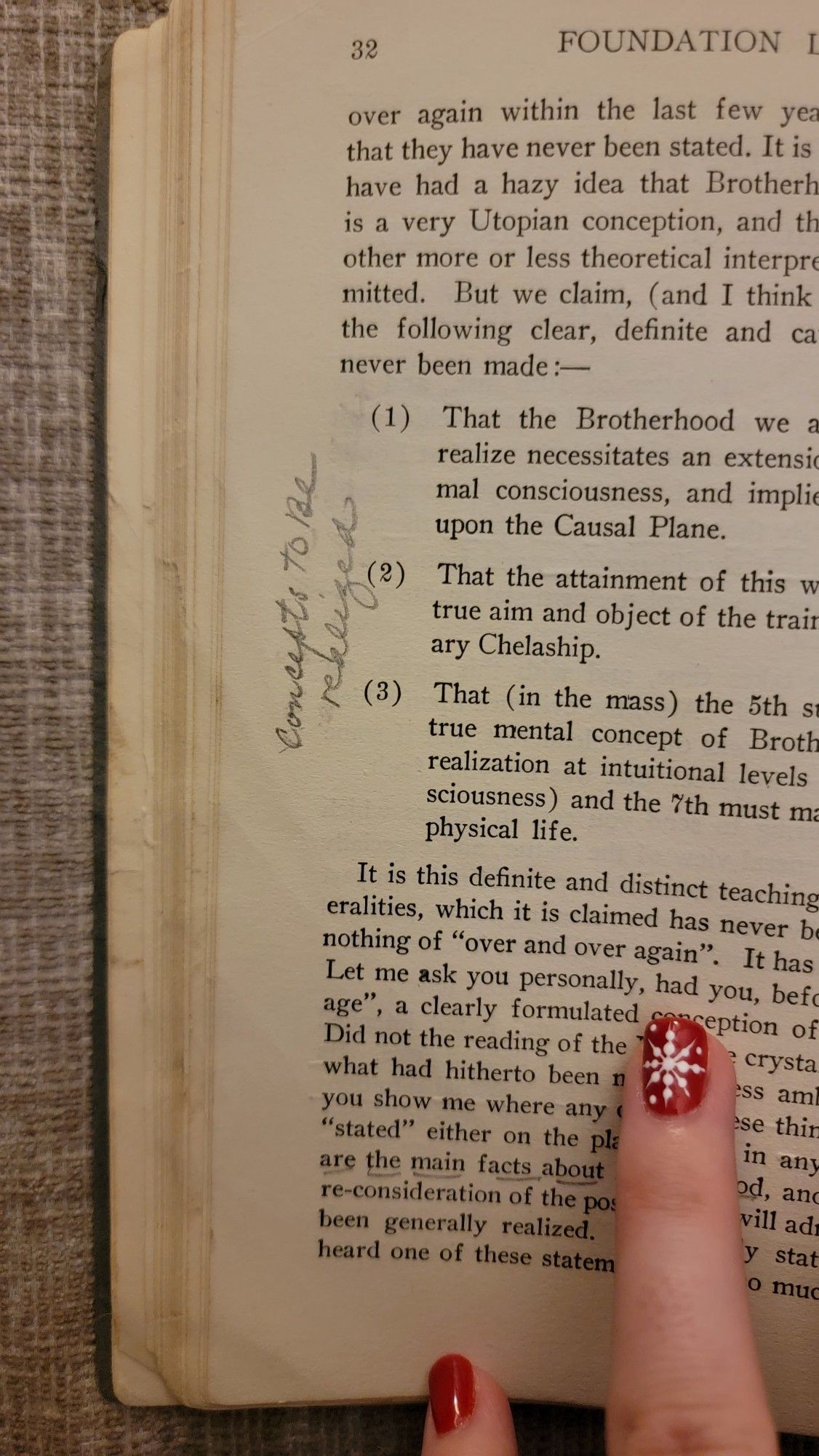 Open page of book with a hand written note in the left margin that reads, concepts to be realized