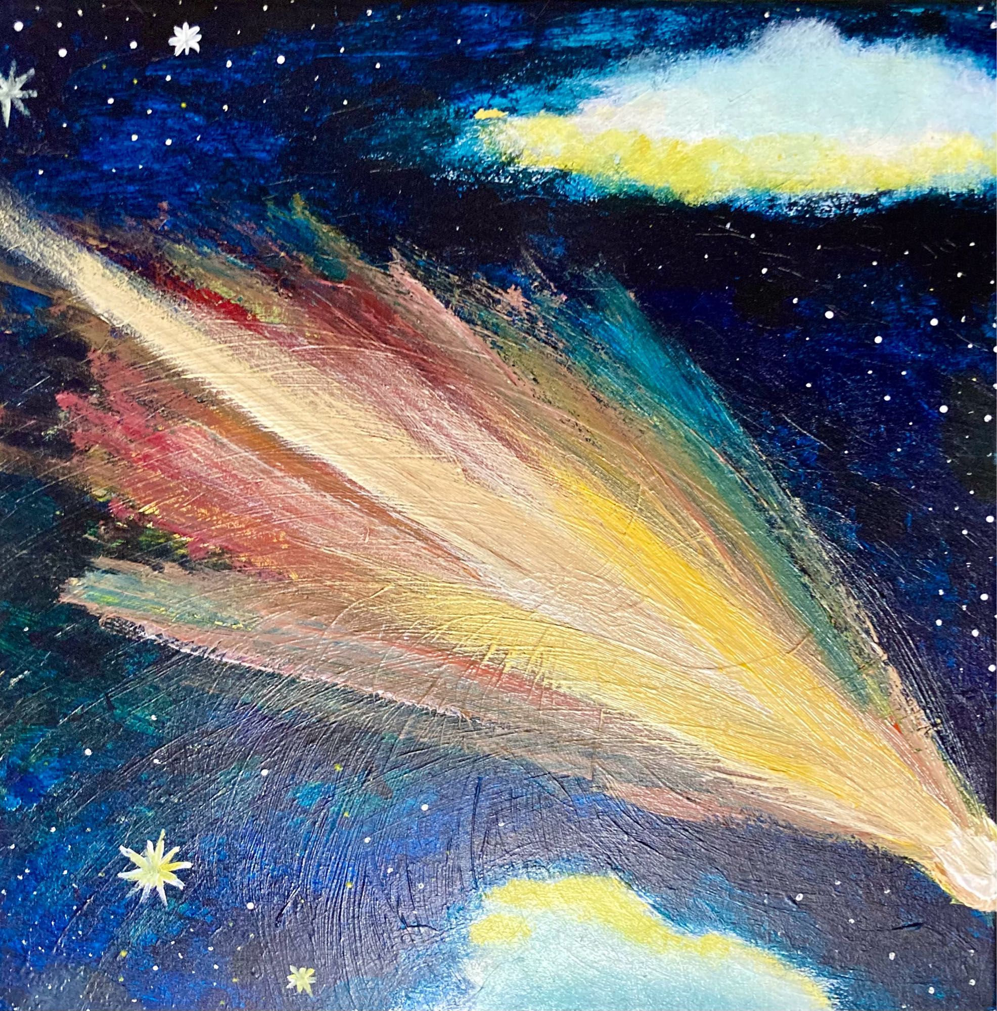 A bright shooting star against a starry night sky with a cloud on either side.