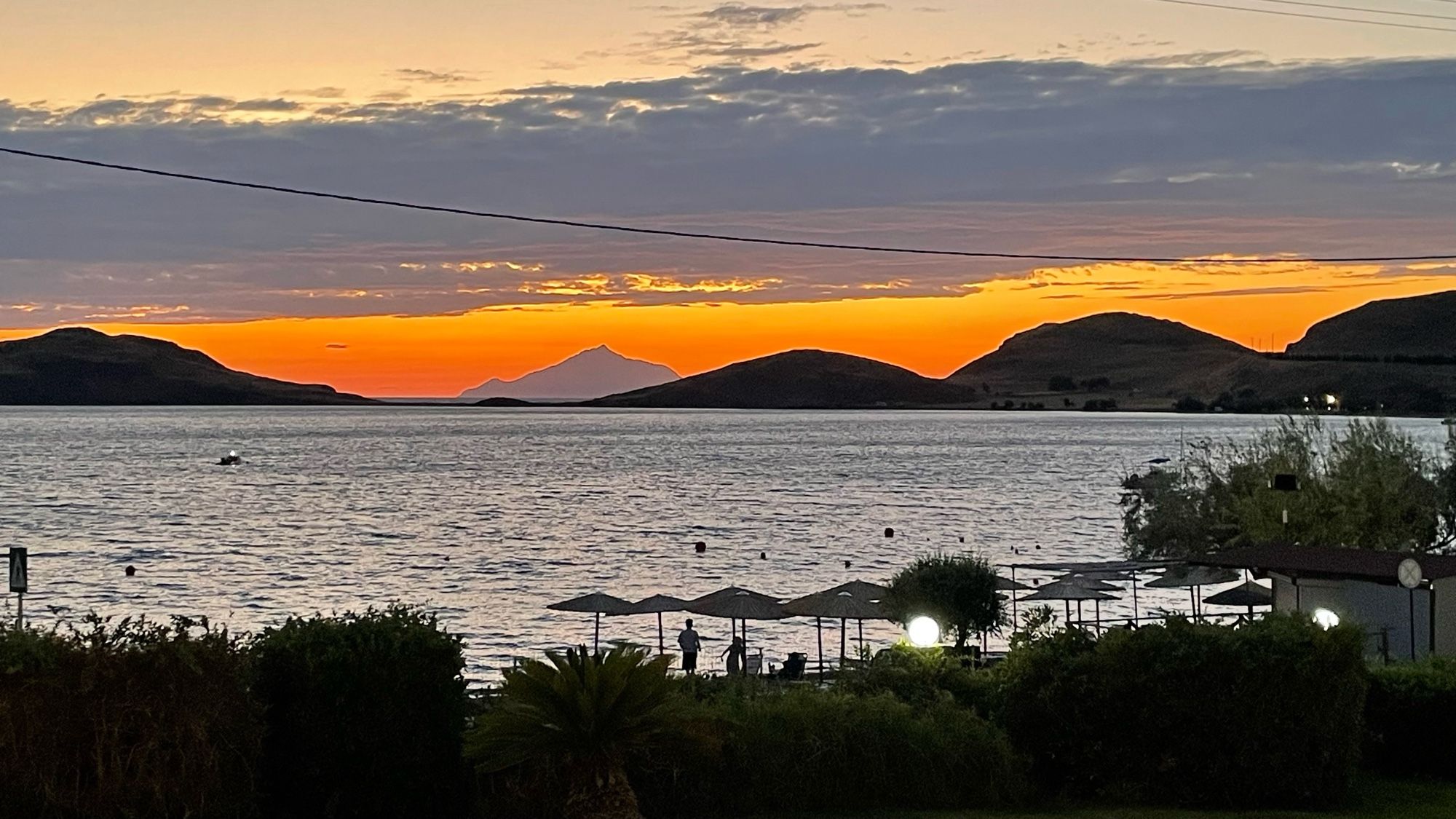 Sun setting behind Mount Athos viewed from Lemnos.