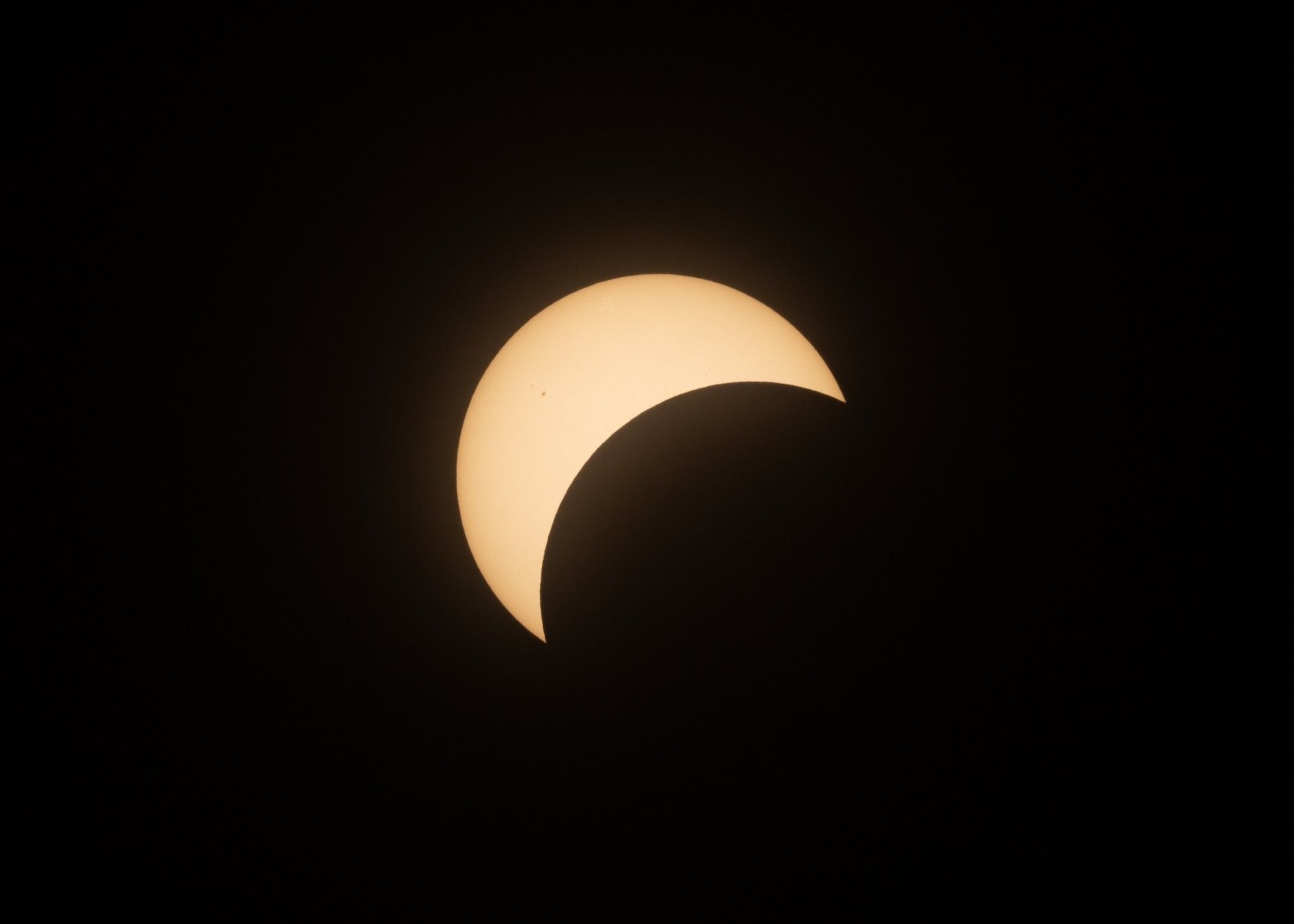 Sun partially covered by the moon during the eclipse