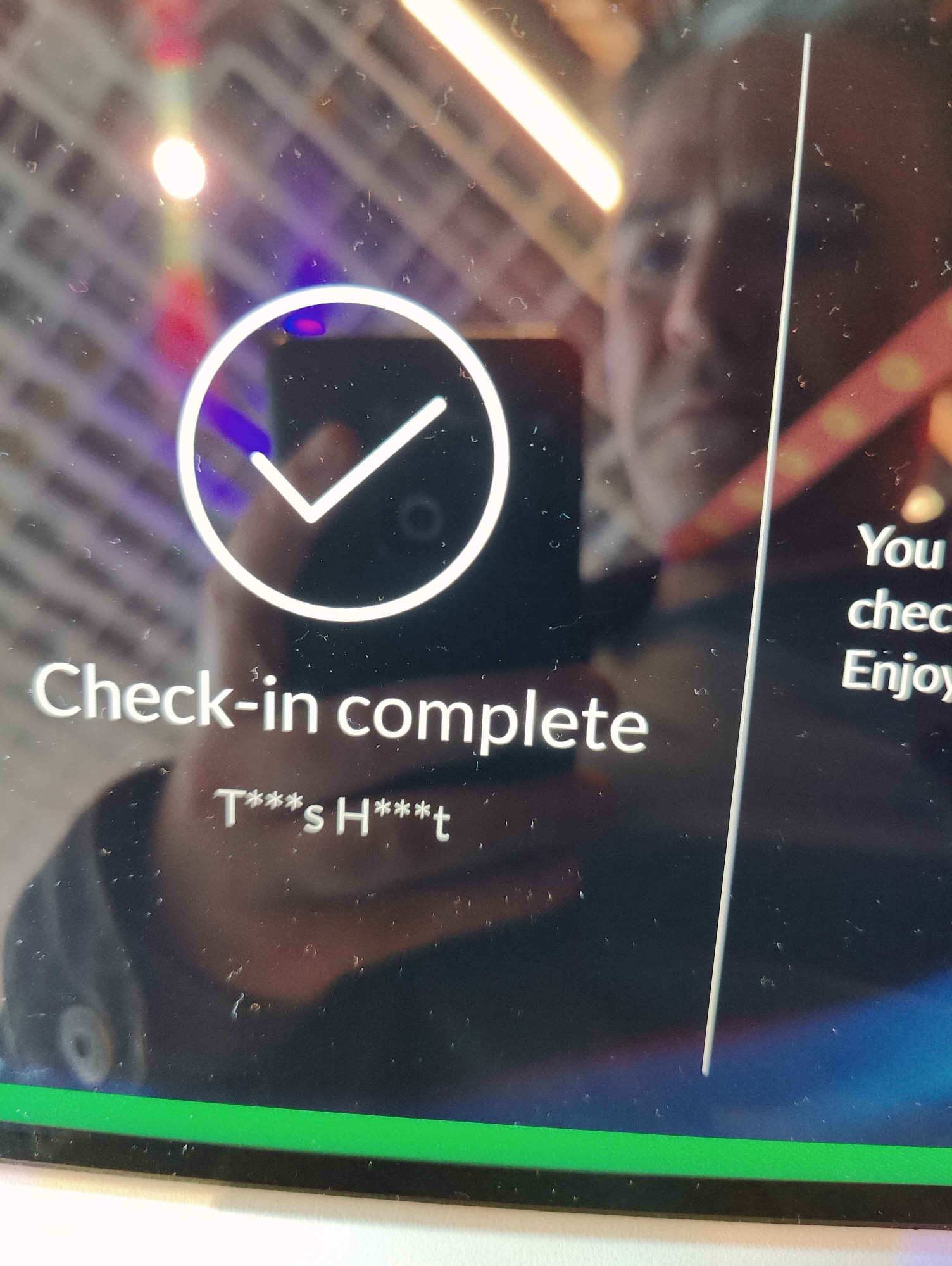 My name being displayed on a check-in kisok at UnrealFest 2024 as "T***s H***t"