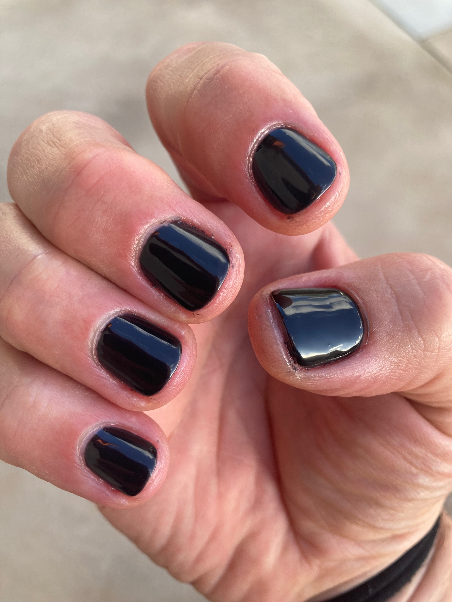 A pic of Lauren’s fingernails showing her shiny new black gel polish.