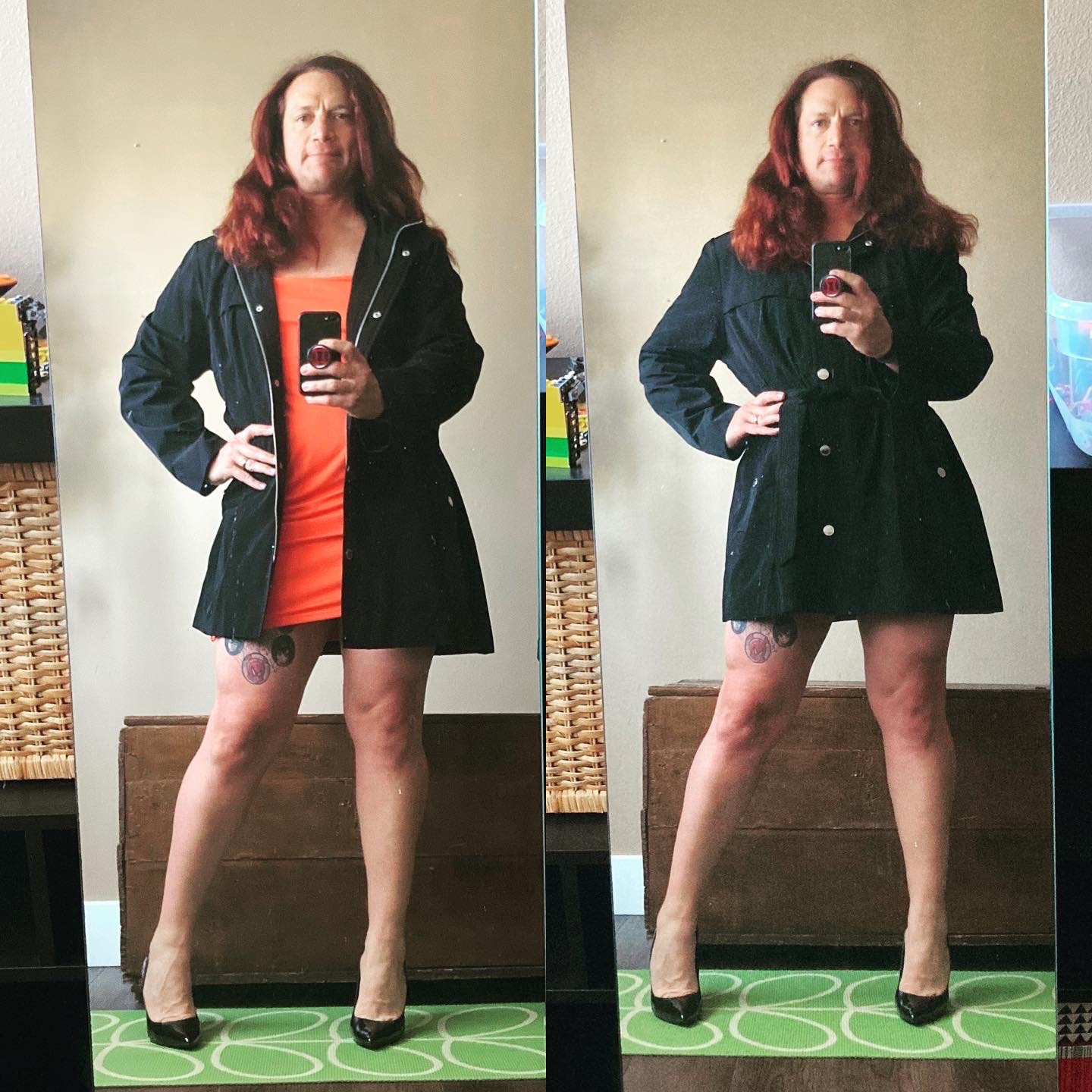 Mirror selfies of Lauren. She is facing the camera wearing an orange dress with a black trenchcoat-style raincoat that hits at midthigh. The coat is just longer than her dress, leaving her legs exposed. She’s wearing black heels and her long red hair is down.