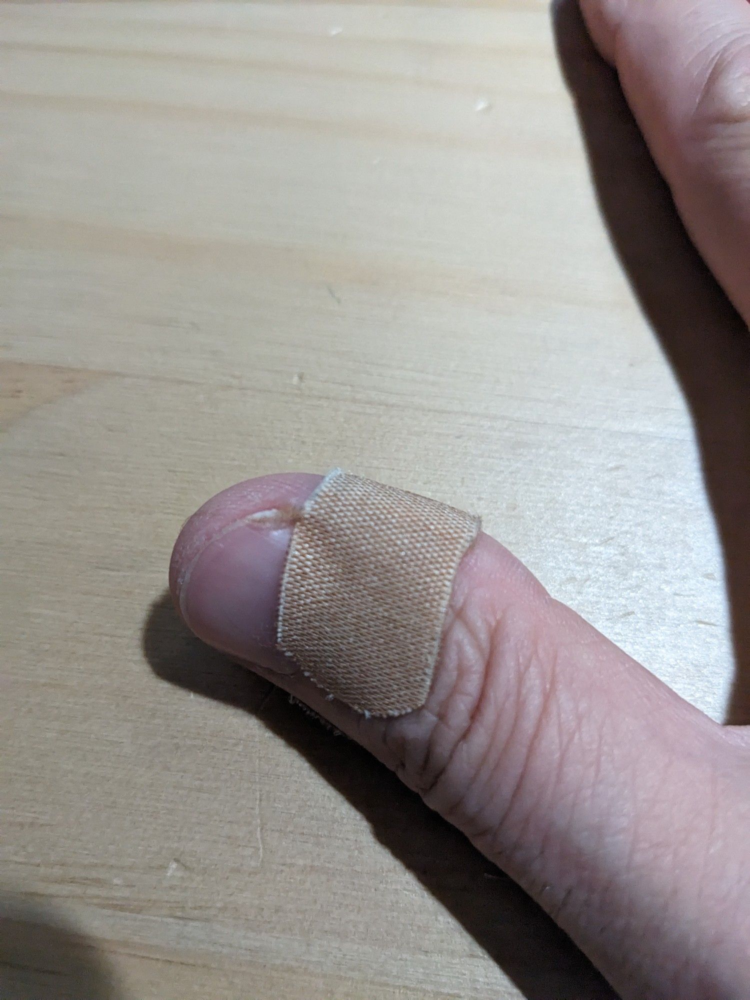 A bandaged thumb