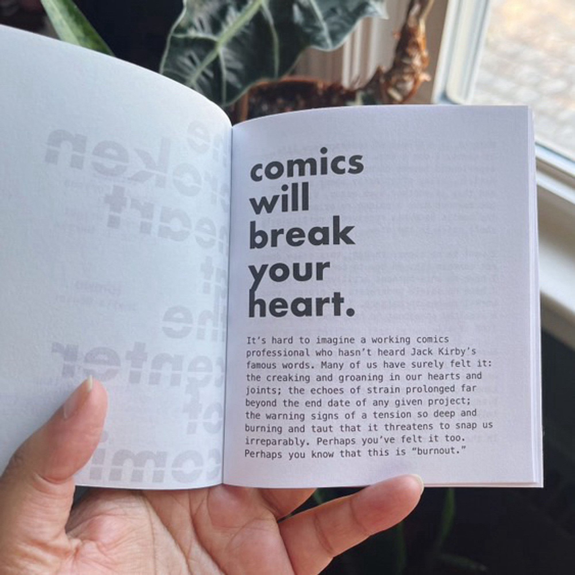 The inside of the zine “the broken heart at the center of comics.” The zine is opened to the first page that has large text, “comics will break your heart.”