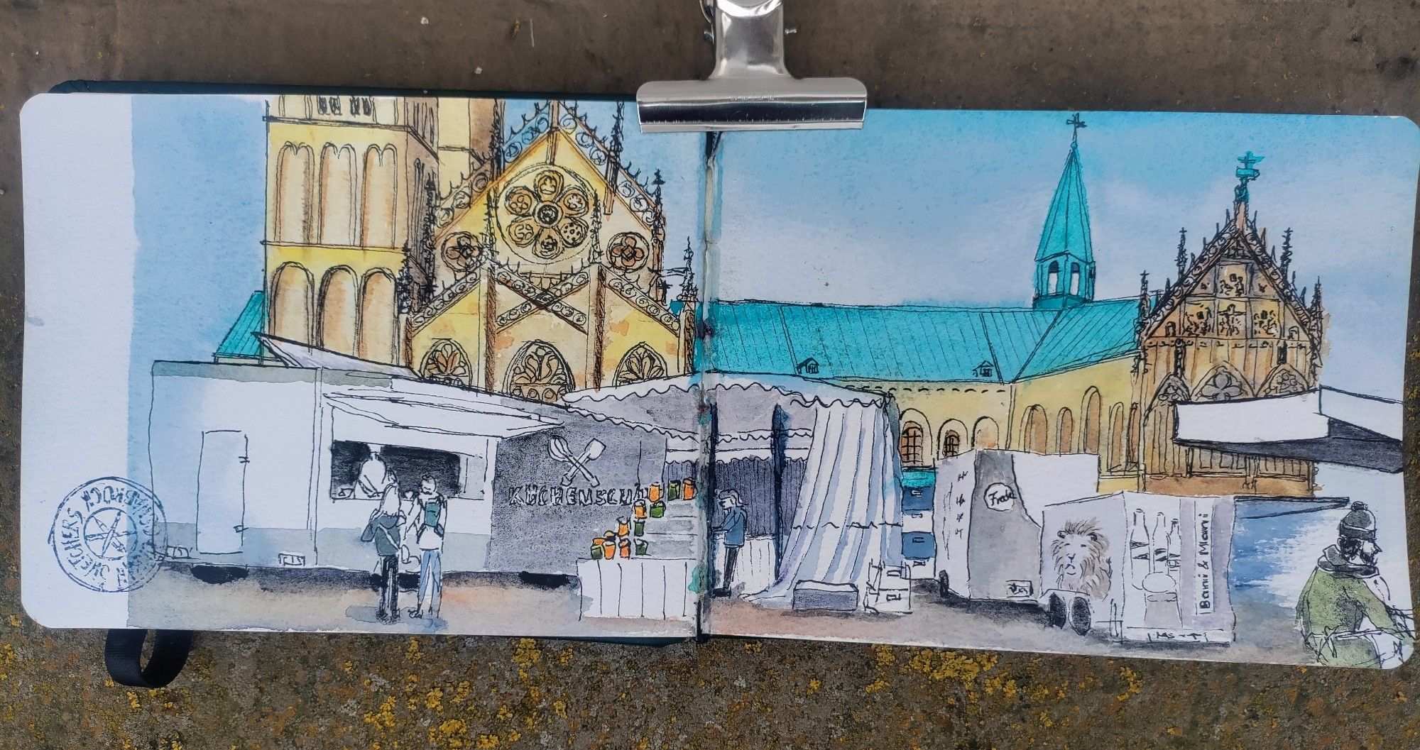 Urbans sketch double page in a sketchbook with ink + watercolor of a cathedral and market