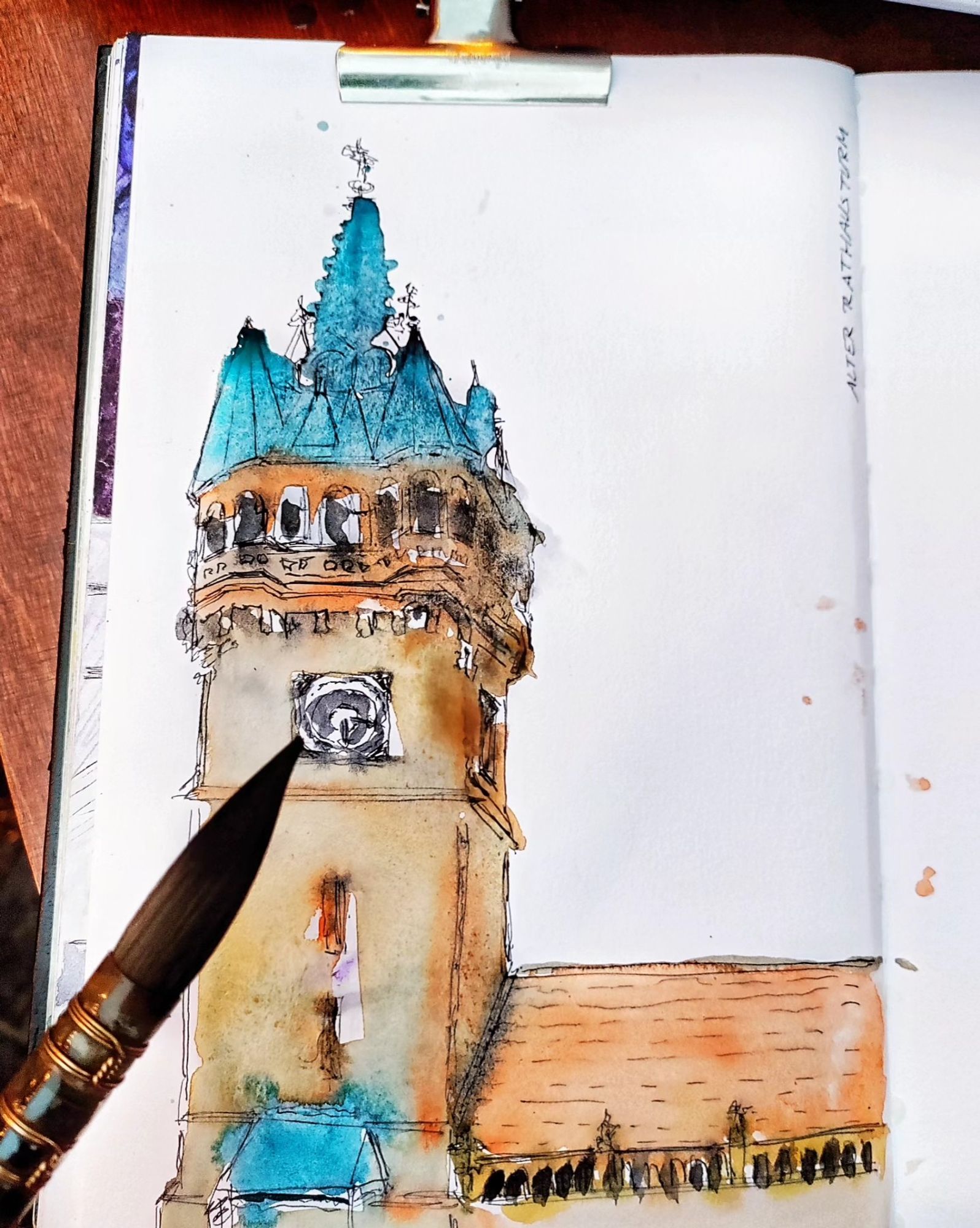 A sketchbook watercolor & ink sketch in teal (roofs) and ochres (stones) of Braunschweigs old town hall tower