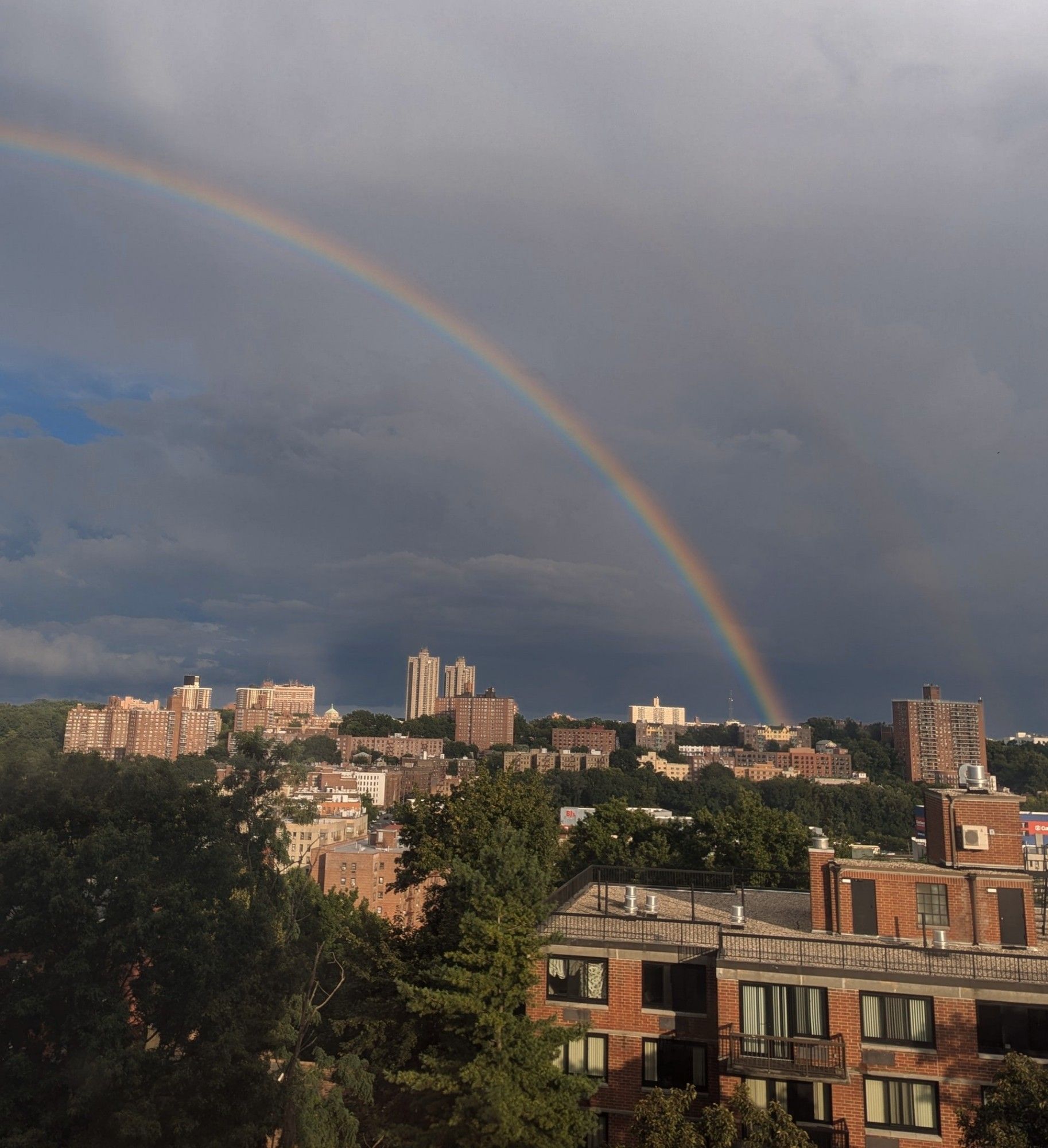 A rainbow over a cityscape