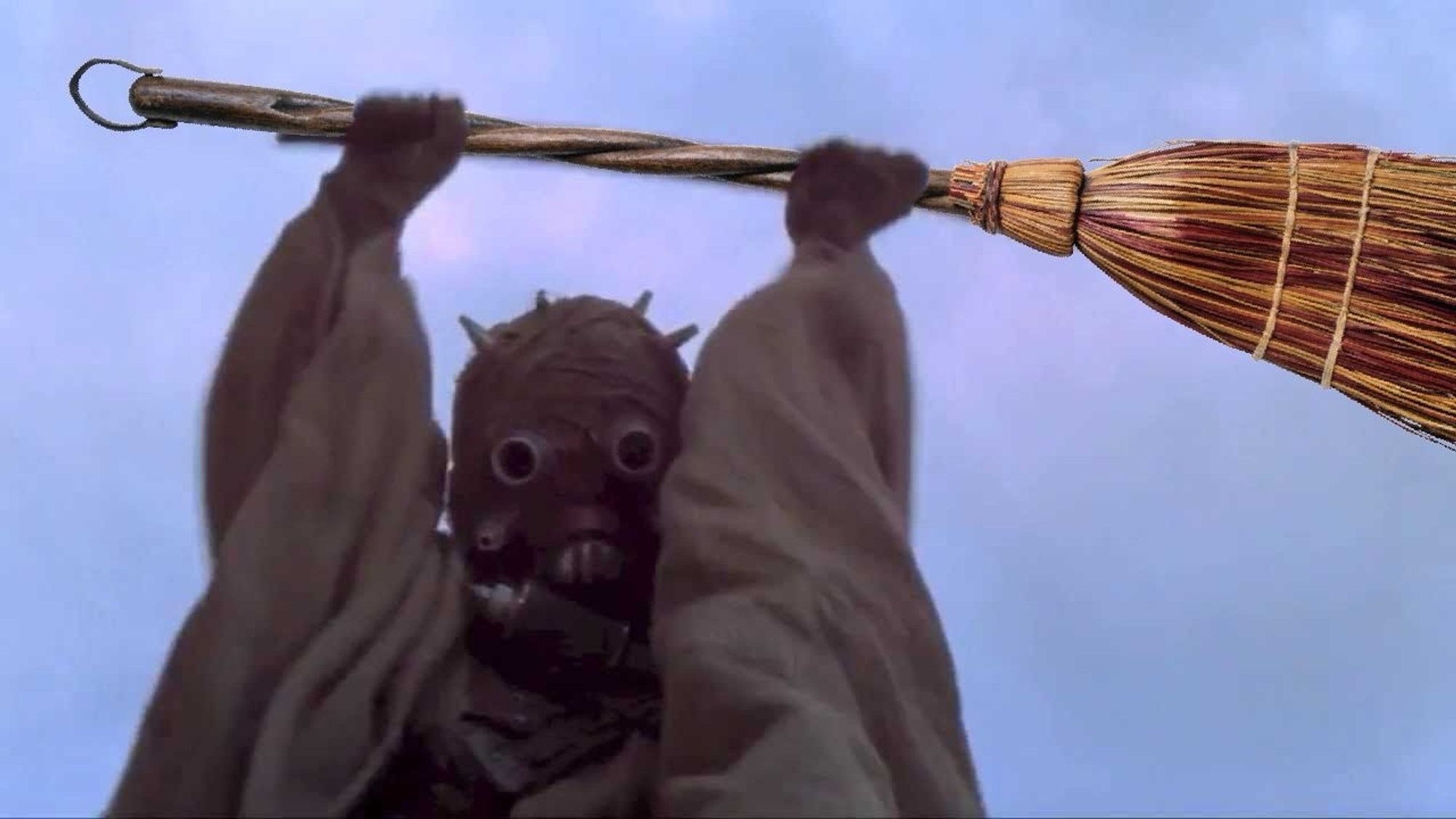 An image of a tusken raider from Star Wars with a broom