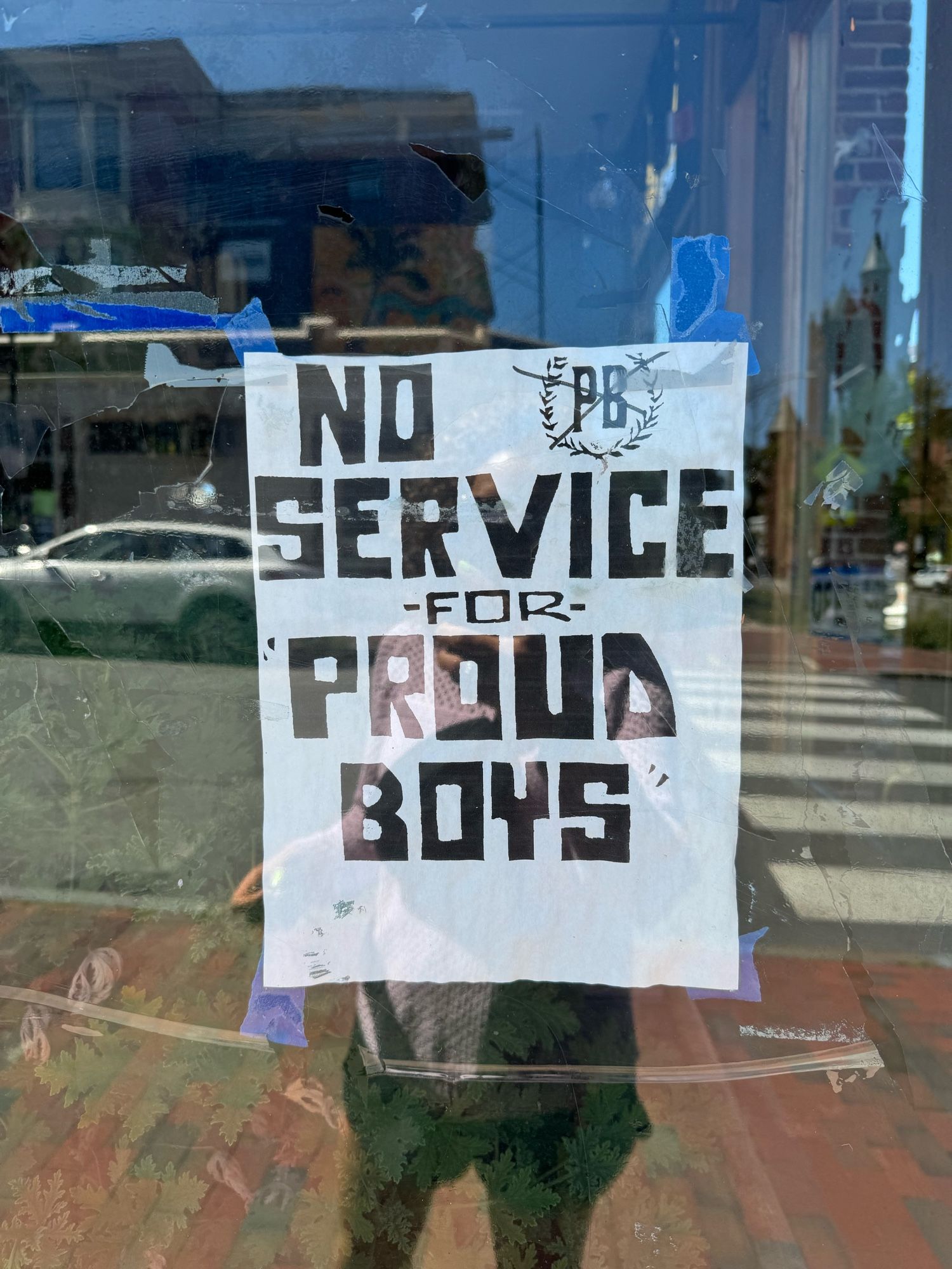 A photo I took outside a Portland, Maine restaurant that shows a handmade window sign that says “no service for proud boys” and features a proud boys logo with an X through it