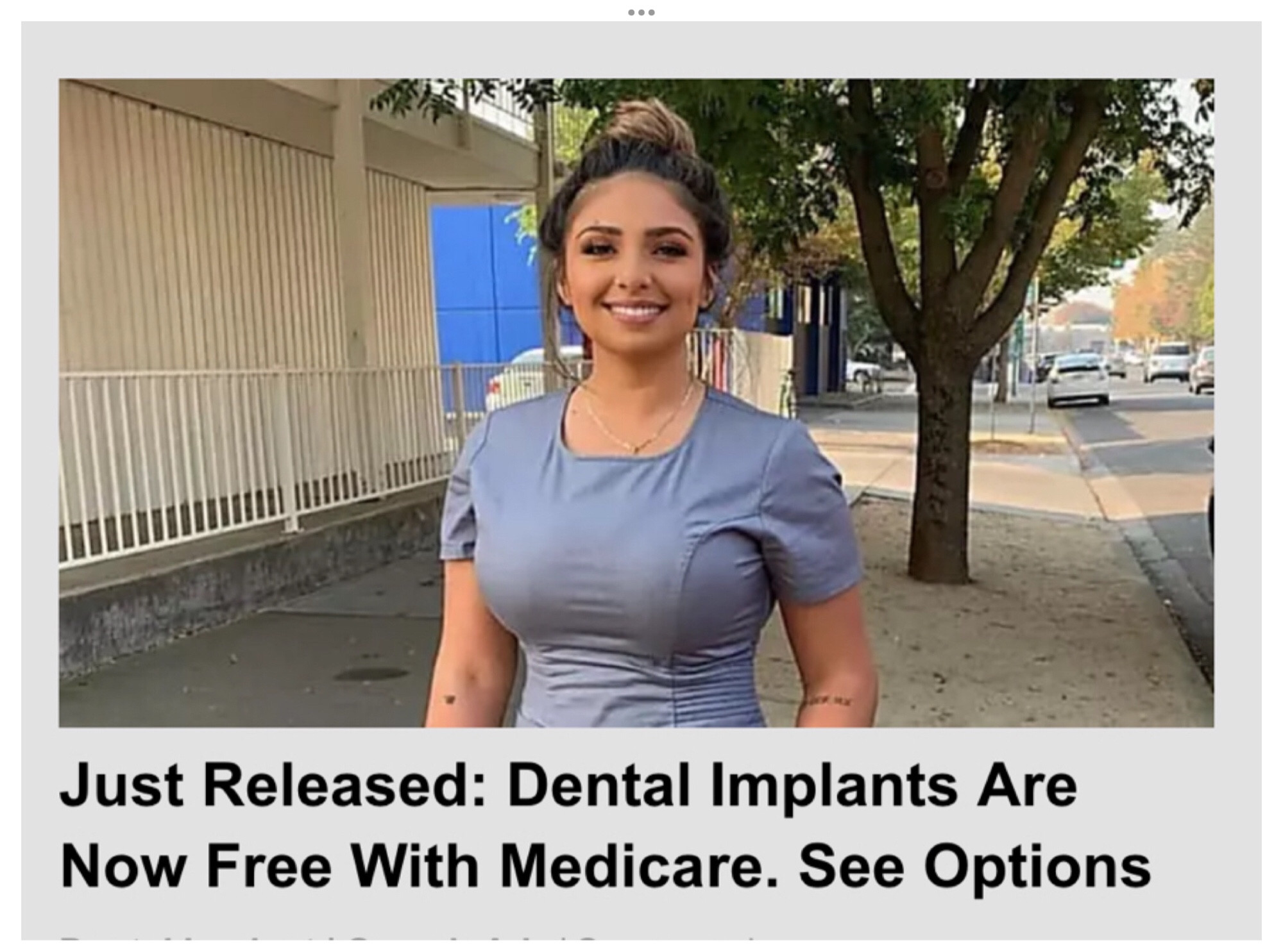 Photo ad of large chested woman with the copy: Just Released: Dental implants are now free with Medicare. See options.  