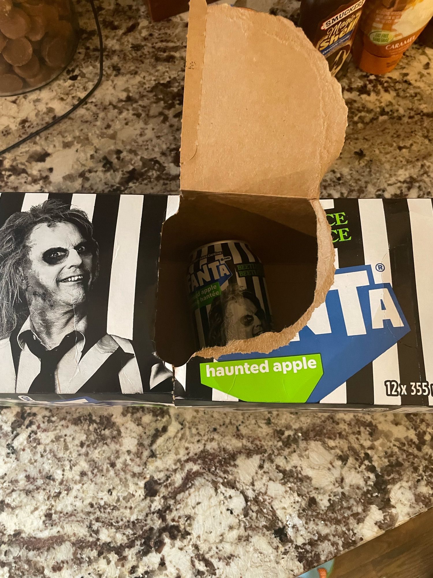 Image shows a case of Beetlejuice “haunted apple” flavoured Fanta, the worst soda ever created.