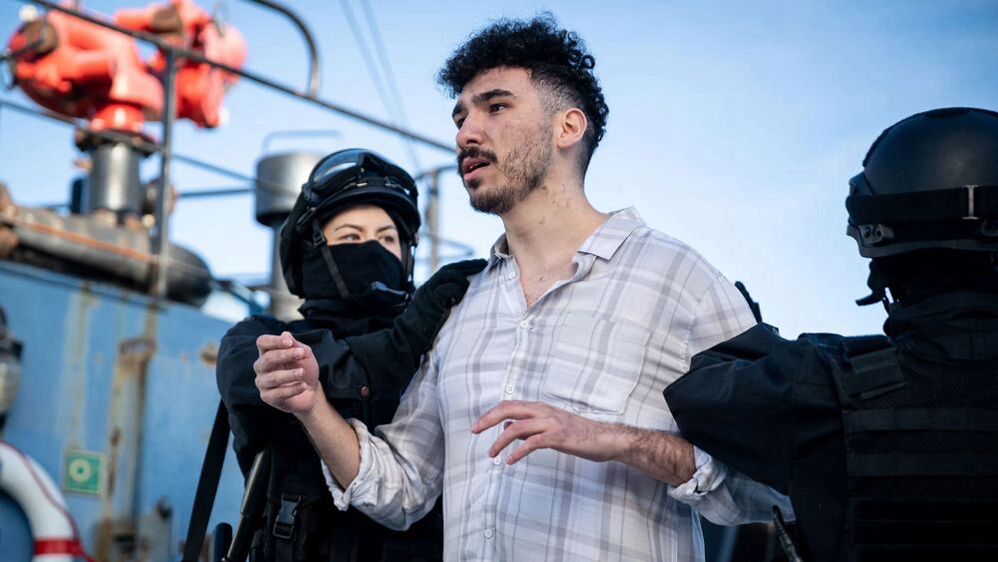 An Afghan refugee is arrested by the SAS on the Tamps