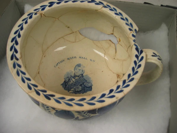 handpainted pearlware chamber pot from Fort Stanwix National Monument dates to c. 1790-1835. 

The exterior decoration suggests that the chamber pot was stored in a bedroom, while the image of Captain Basil Hall on the interior suggests that the owners were not fond of Captain Basil Hall. The practice of including portraits inside chamber pots became popular during and directly following the Colonial period in America, specifically portraits of kings.  https://nmscarcheologylab.wordpress.com/2011/04/20/ask-a-curator-handpainted-pearlware-chamber-pot/